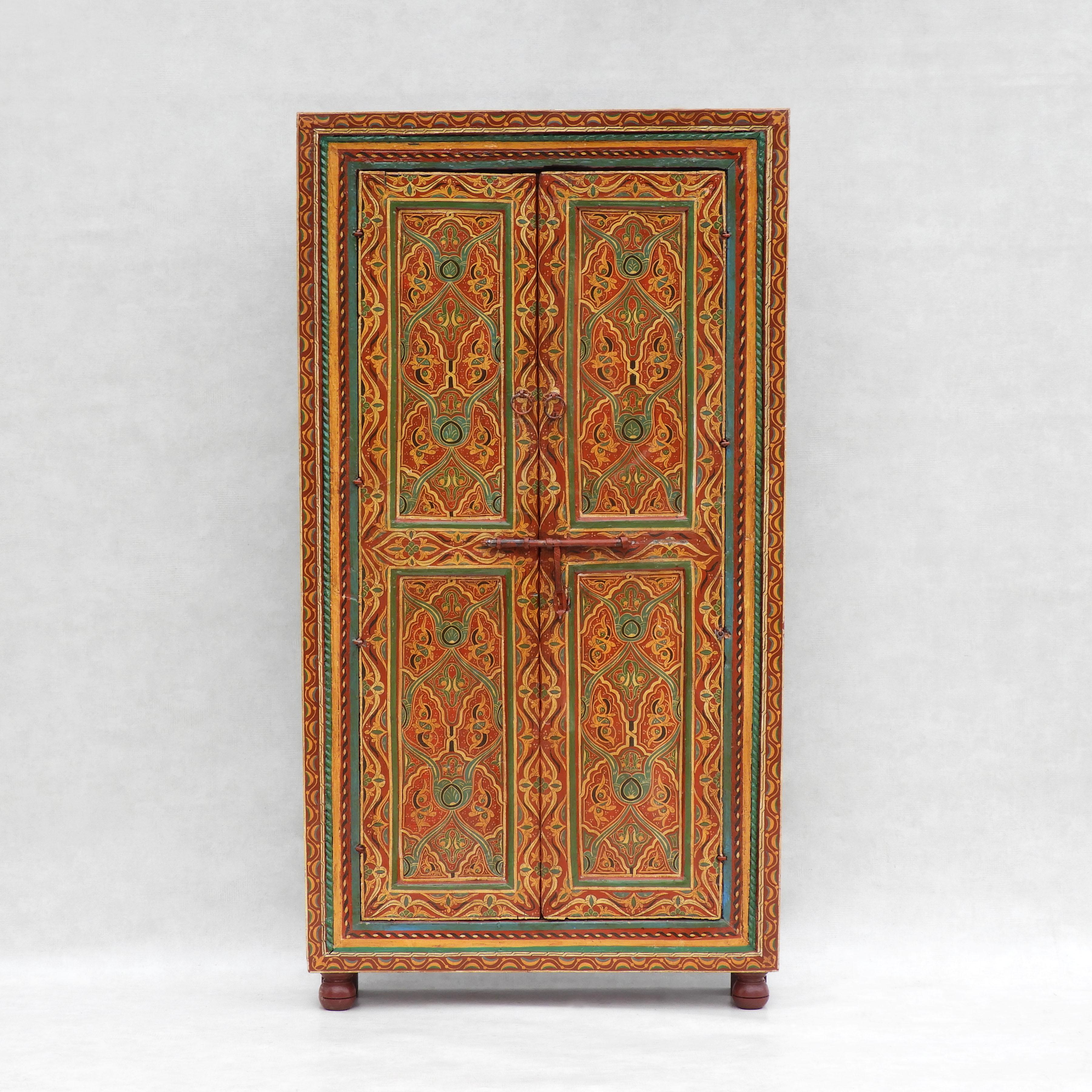 One of a kind Moroccan open backed cupboard.  Beautiful, vibrant, hand painted double doored cabinet in great antique condition. A fabulous original piece that can be wall mounted and used 'as is' or adapted to fit your personal requirements. A