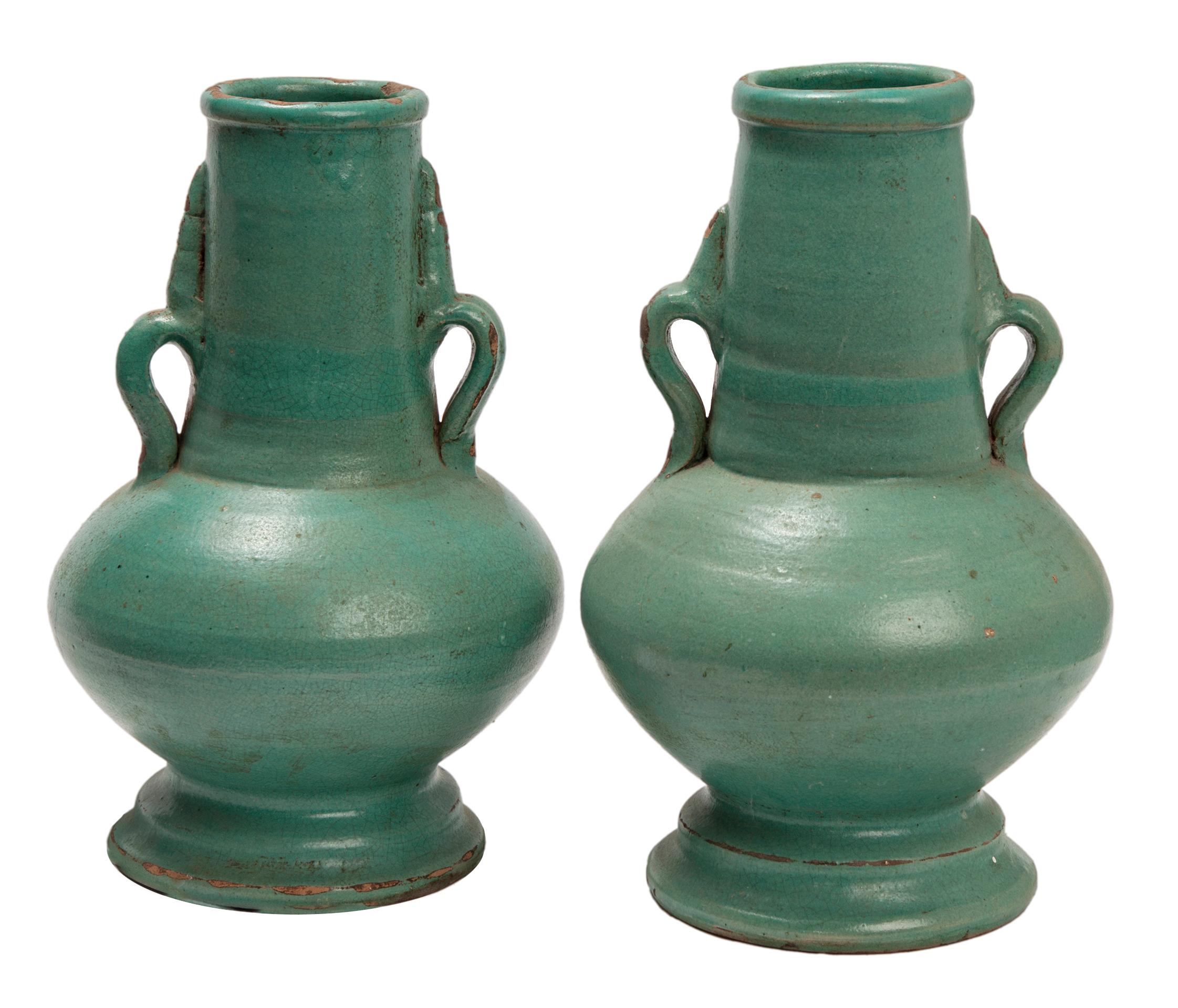 Hand Raised Moroccan Ceramic Vases with a matte green glaze. These Moroccan vessels created in the style originally used by Berber tribes to store water. Moroccan ceramics are defined by a confluence of influences, geography & melding cultures which