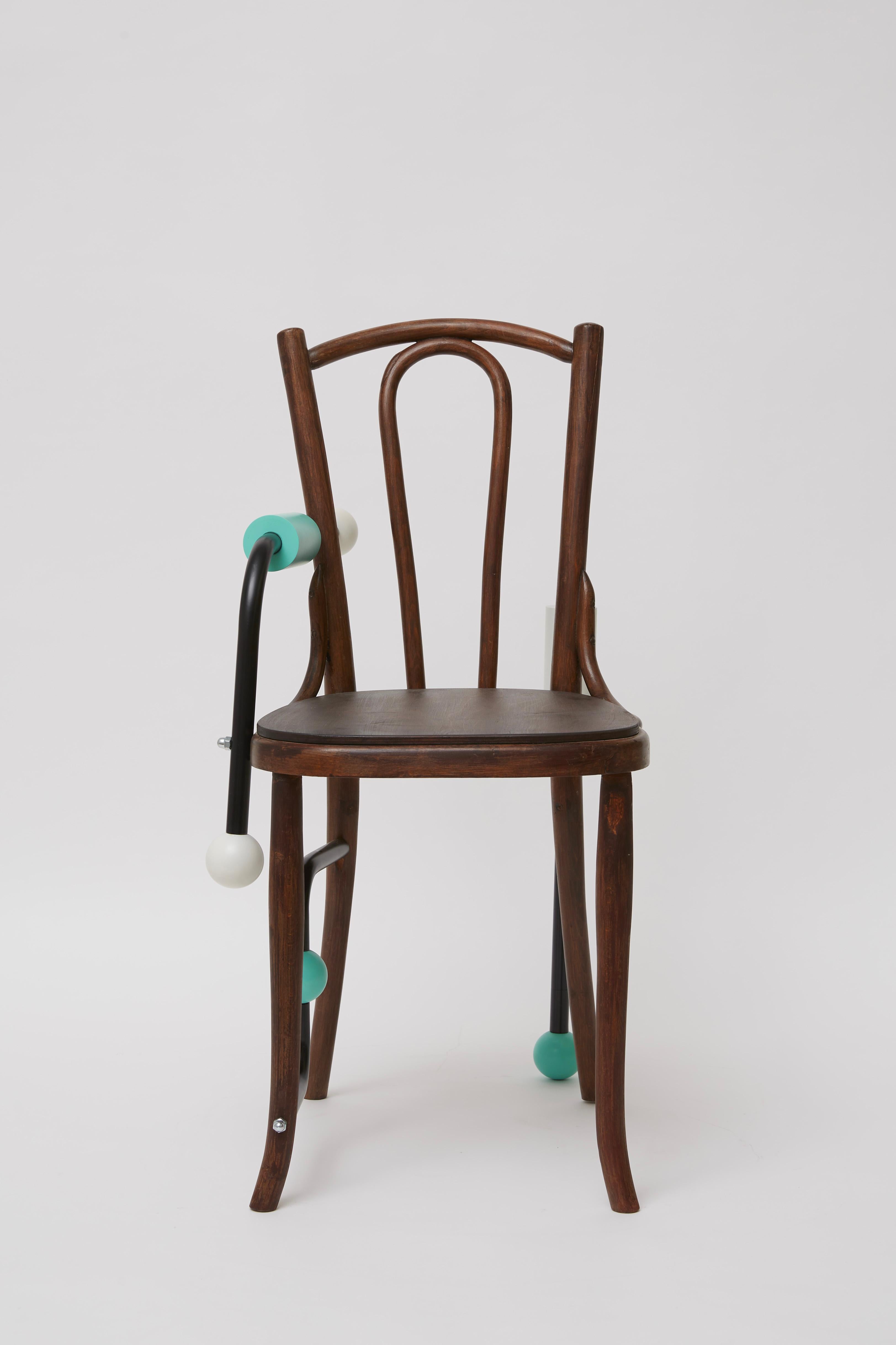 A rustic design from the 19th century enriched with playful cylindrical steel elements and white-and-teal geometric inserts, this chair was inspired by the Morse alphabet. An intense conflict of styles and finishes defines its eclectic character,