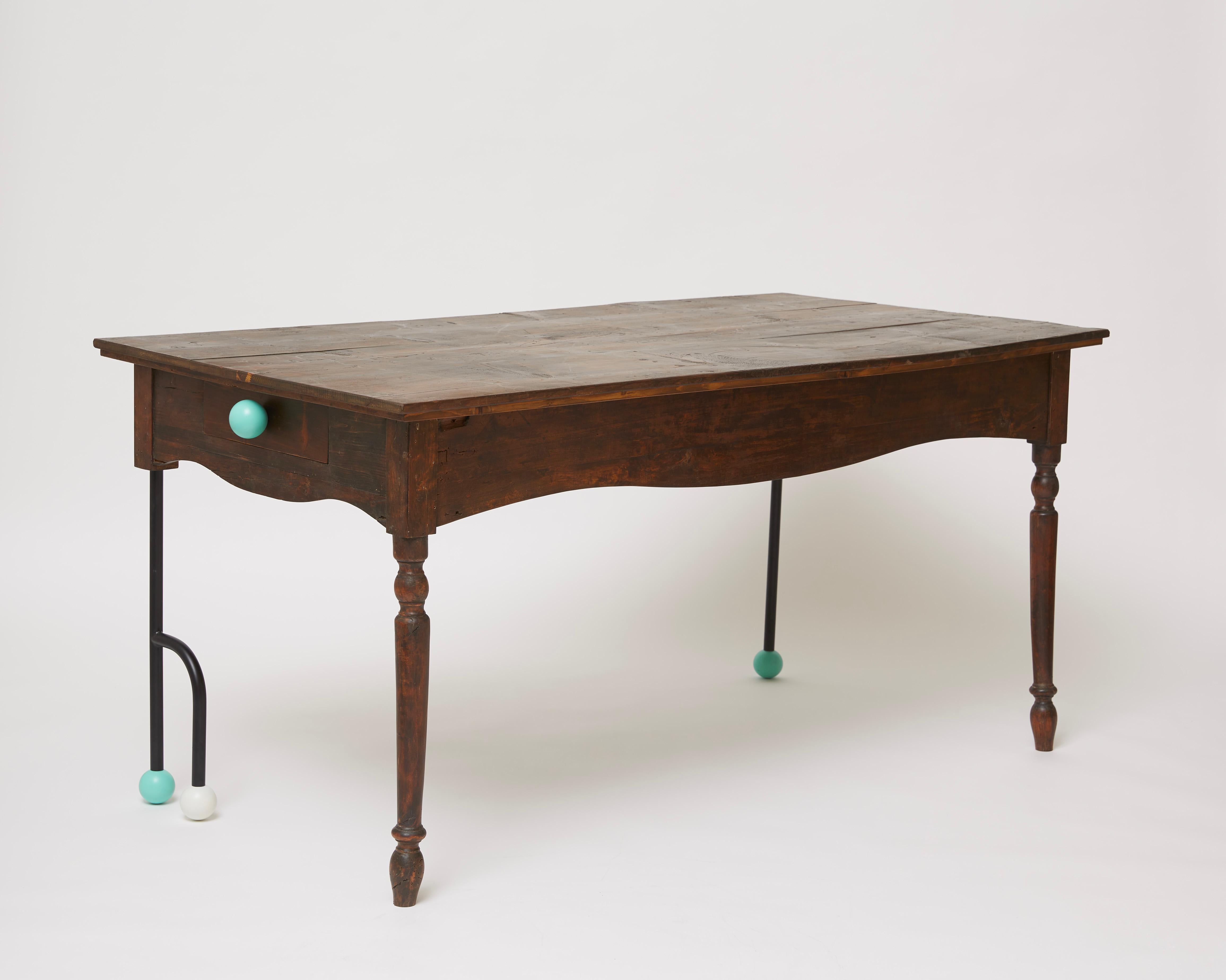 Brimming with eclectic charm, this rectangular table from the Morse Clash Collection embodies the audacious personality of an authentic objet d'art inspired by the dots and dashes of a language. The steel tube inserts and teal and ivory spherical