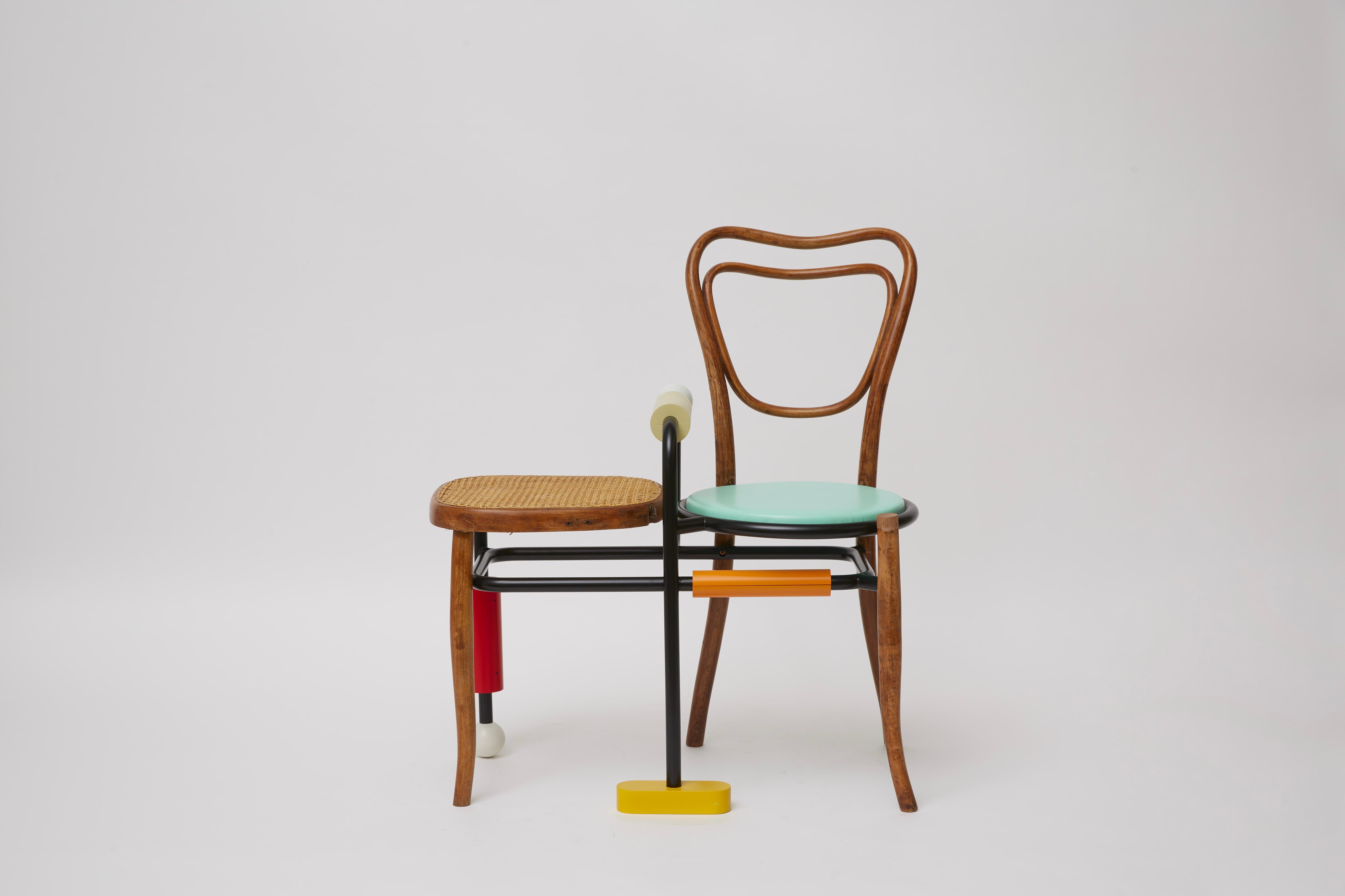 Part of the Morse Clash Collection of designs developed having in mind the eponymous language made of dots and dashes, this Thonet-style wooden chair incorporates a side table and structural elements in tubular steel with red, yellow, and light-blue