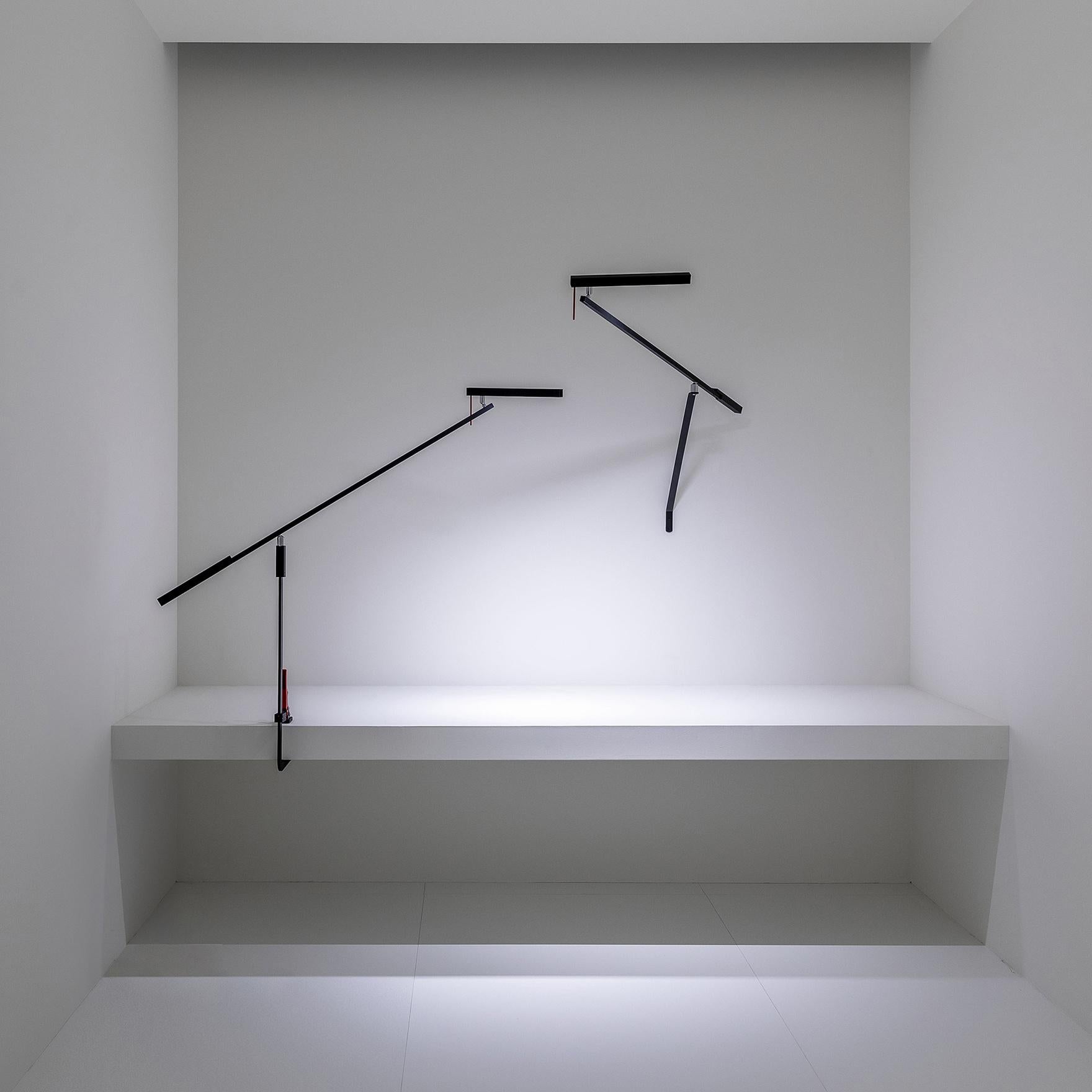 A lamp that can be positioned, balanced and turned,
but overall it produces a beautiful light on the table.
It's the wall version of the Morsetto lamp. Three adjustable arms allow the light source to be positioned far from where the lamp is