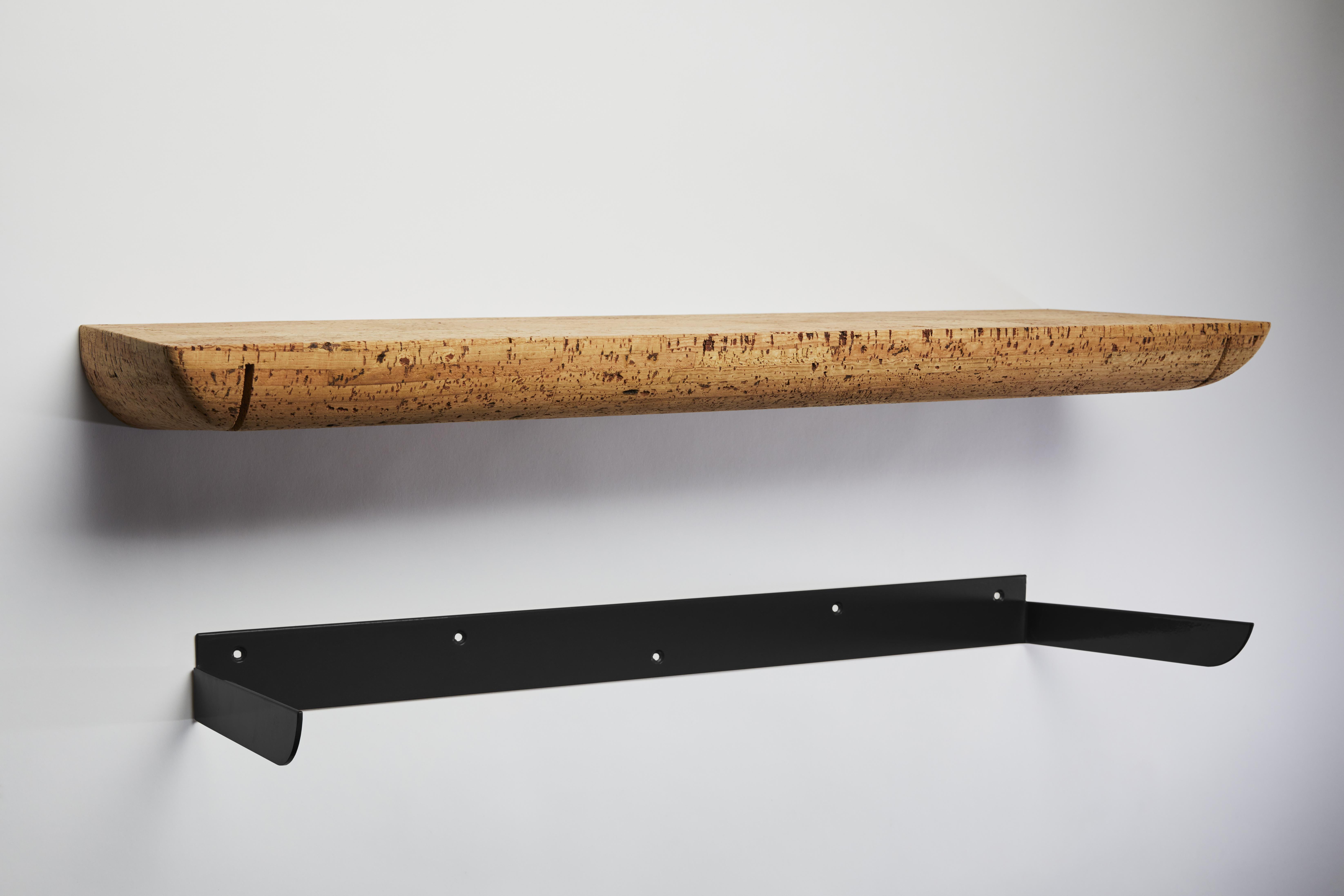 Mortaise wall shelf-400 by Clemence Birot
Dimensions: 75 x 25 x 6,5 cm
Materials: cork, metal.

Clemence Birot started her career in Copenhagen, Denmark, and discovered a design practice closely related to craftsmanship. The latter plays an