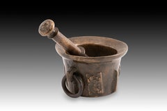 Mortar with pestle. Bronze. 16th century.