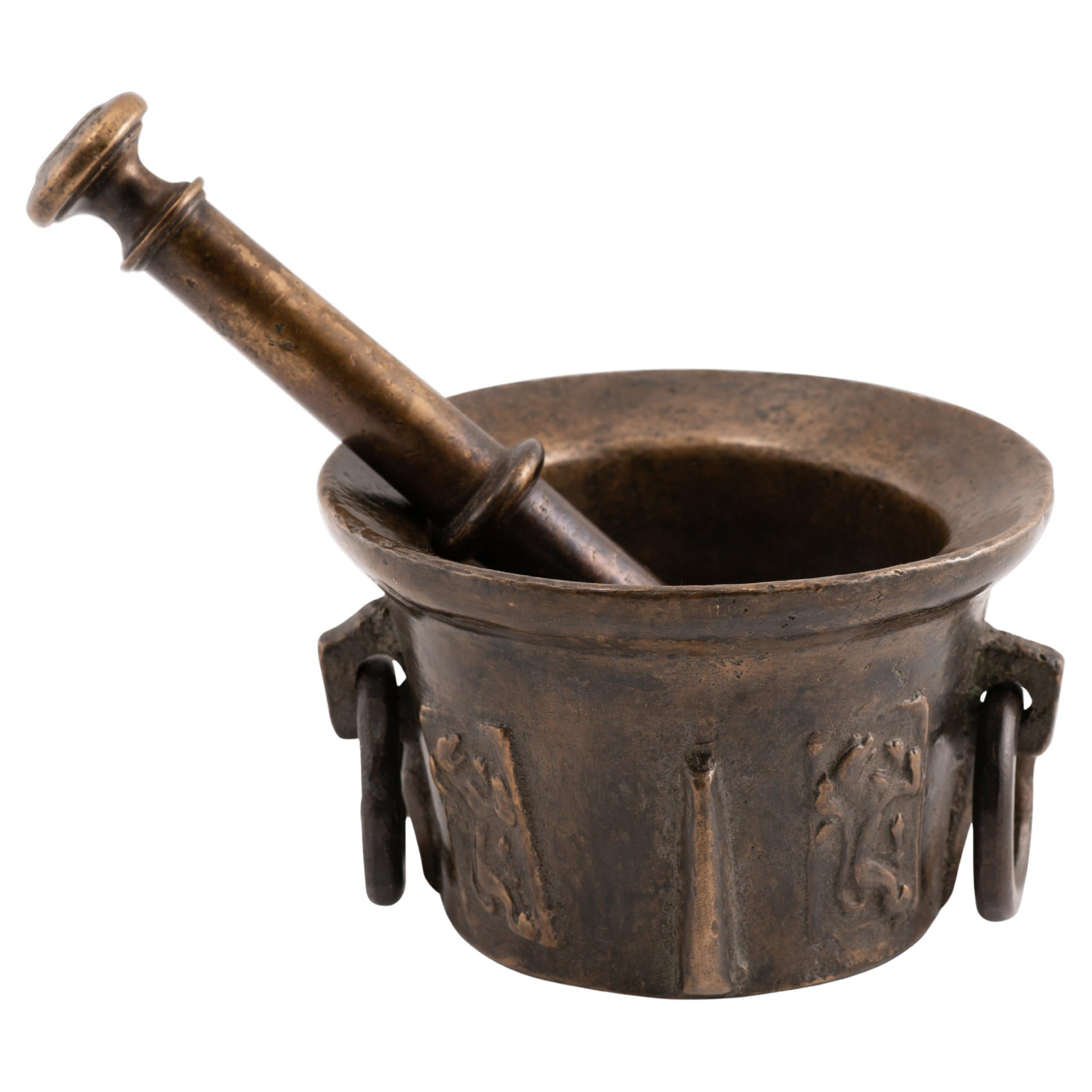 Mortar with pestle. Bronze. 16th century.