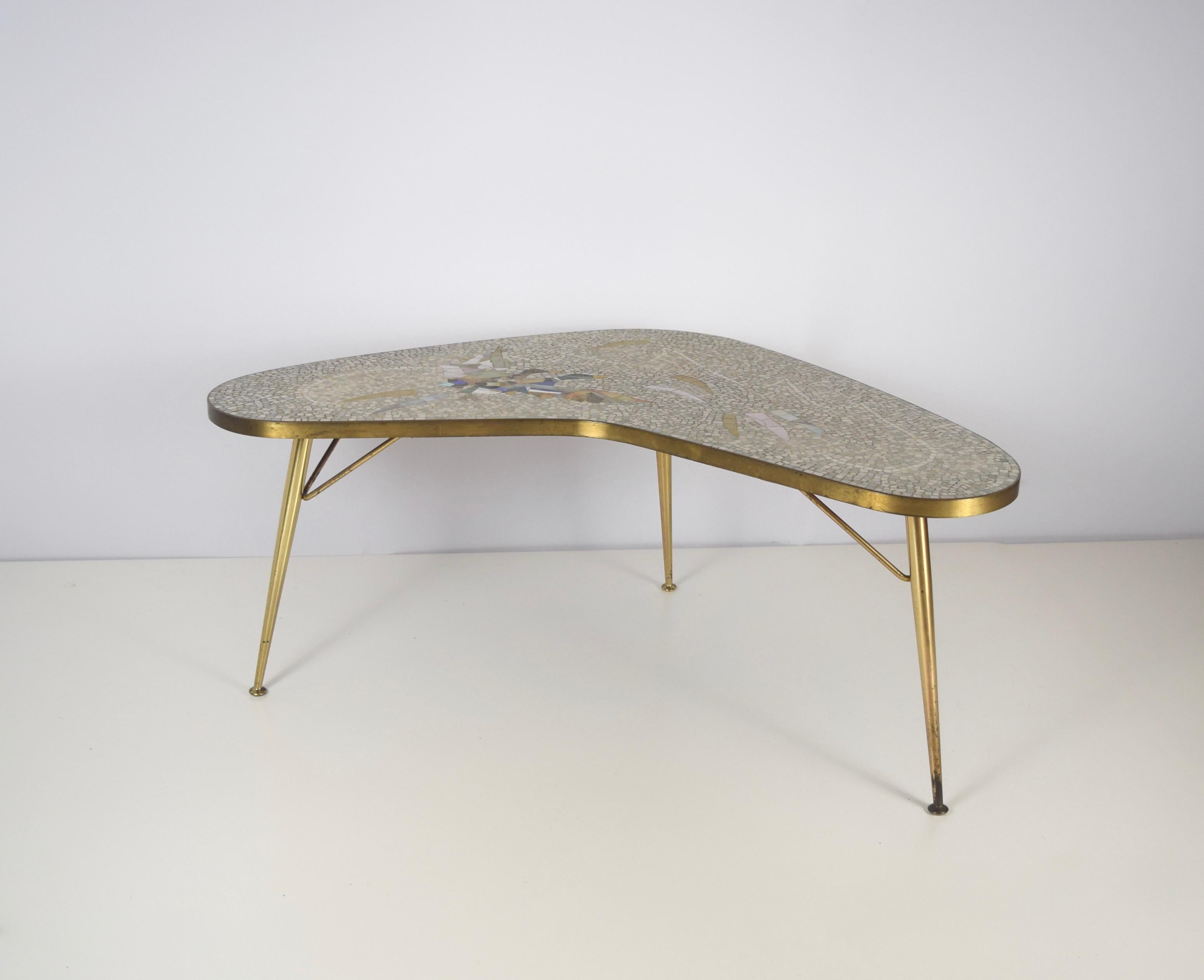 Stunning Mosaic and Brass Coffee Table by Berthold Müller-Oerlinghausen from Germany 1950s. This boomerang shaped table is in excellent condition. The mosaic pictures two ducks and has a very modern color palette. The brass is very shiny and gives