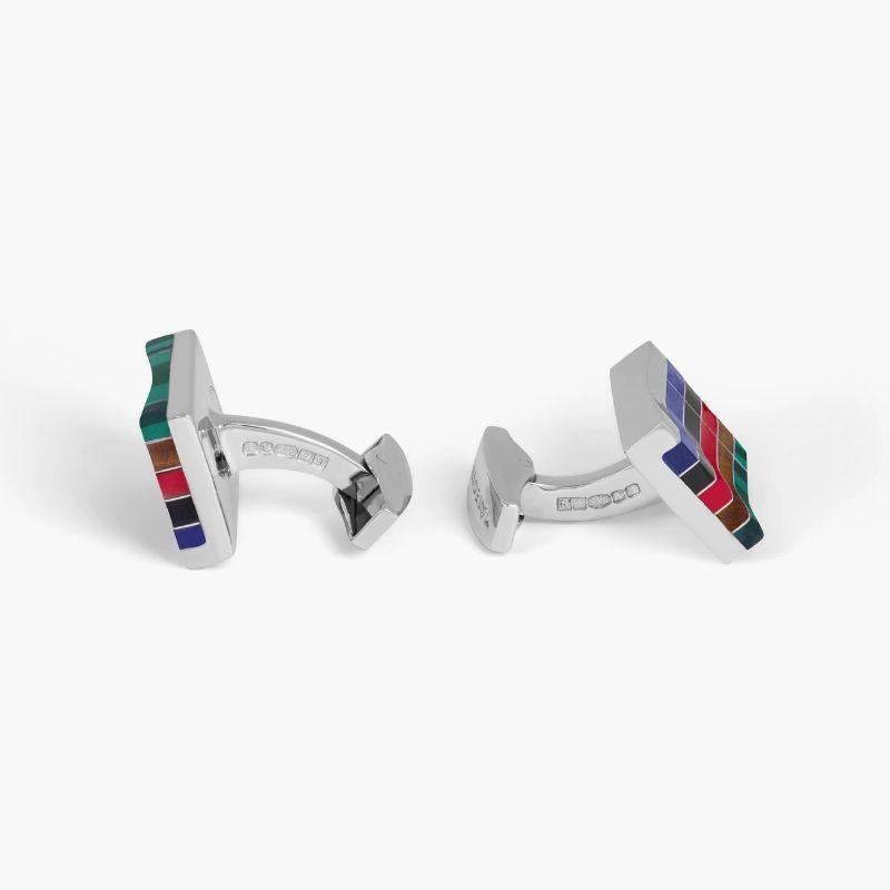 Mosaic City Line Rectangular Cufflinks in Multicolour Tones

A semi-precious stone is flush inlaid with mosaic stripes of silver and has a carved groove area in the centre of these rectangular cufflinks. Five different stones have been incorporated