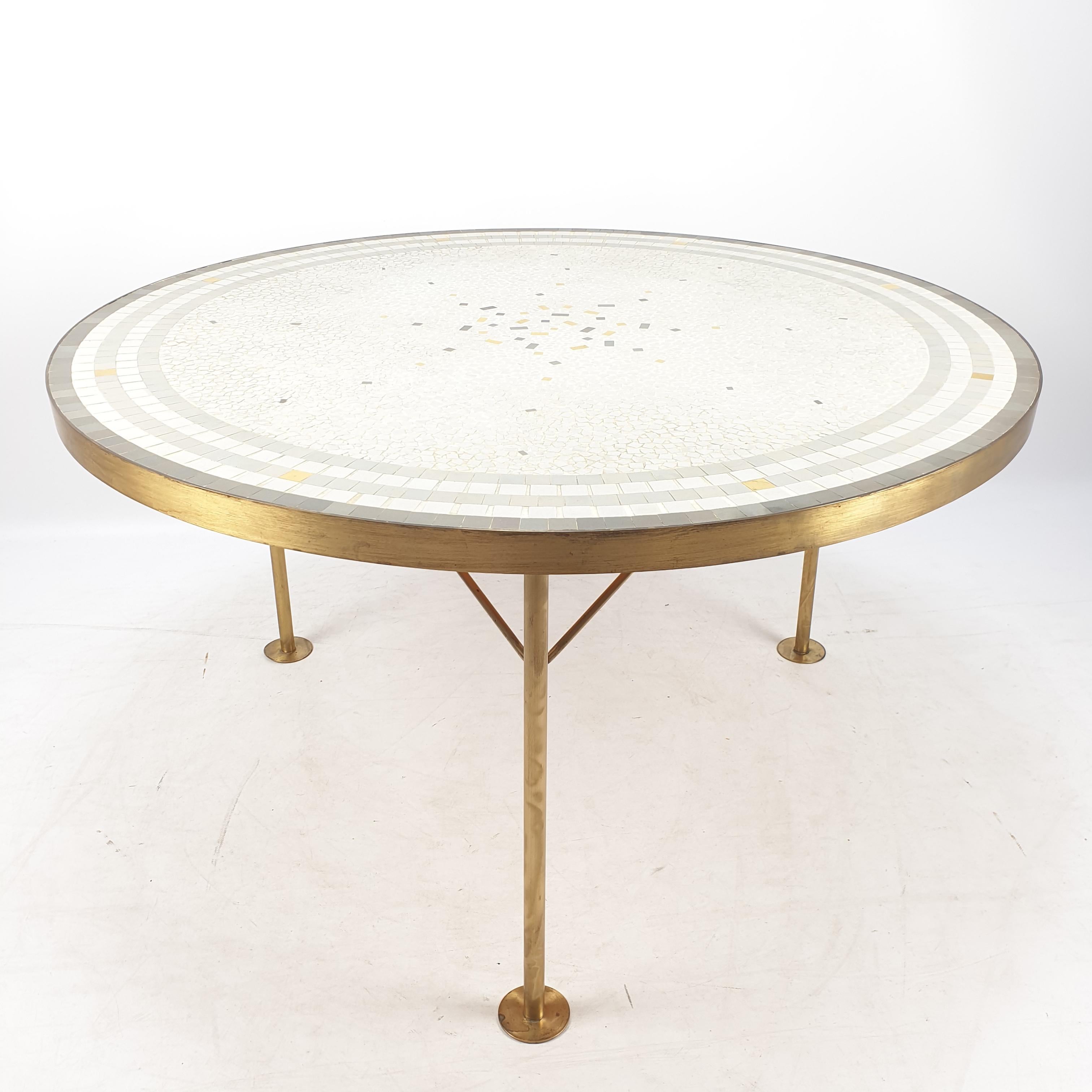 Beautiful round Mosaic top coffee table by Berthold Muller. Brass band around it on three legs. The top has a beautiful composition and the brass has a lovely patina. Berthold Muller-Oerlinghausen (1893-1979) was a German sculptor who specialized in