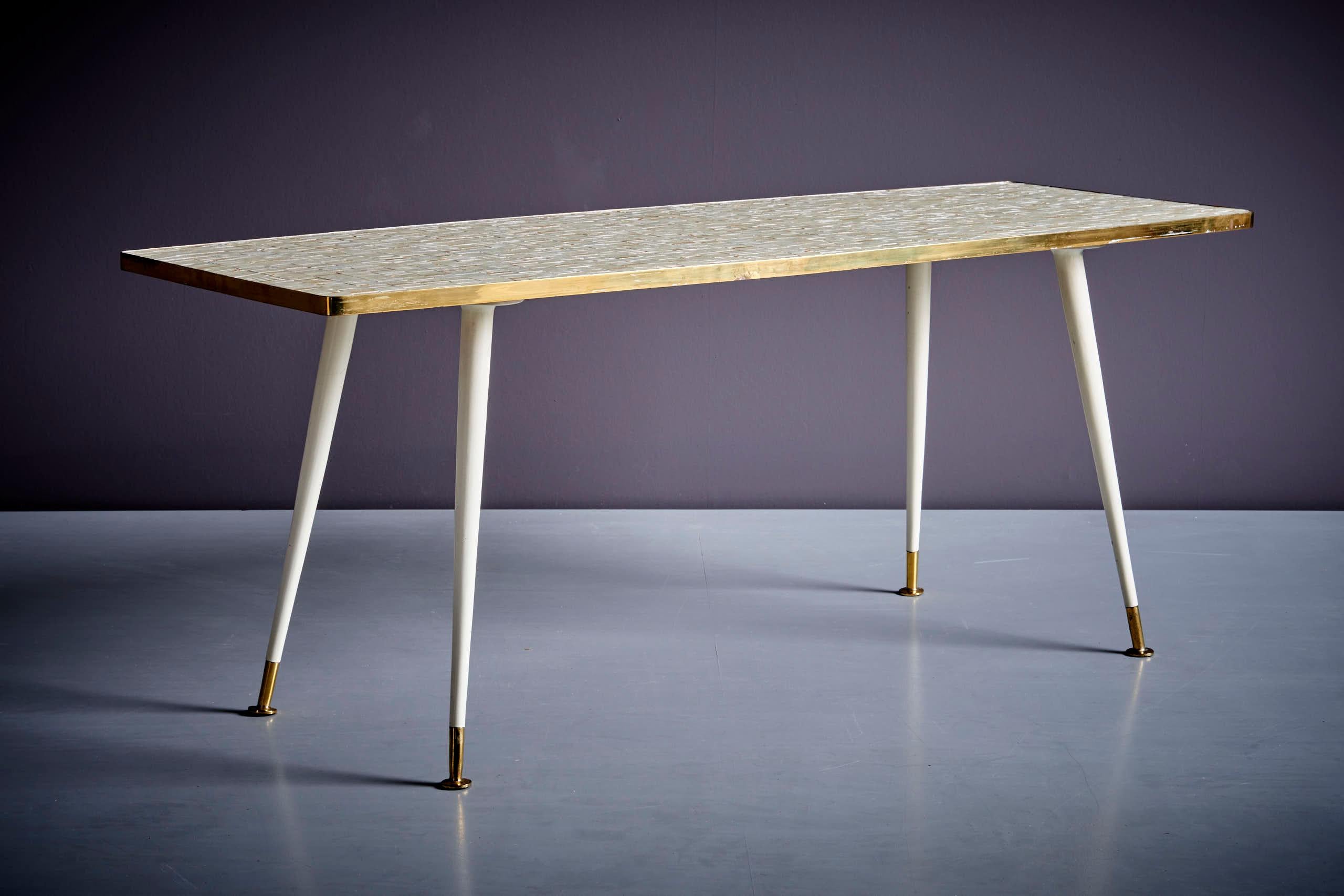 1950’s German Coffee Table with beautiful mosaic table top with brass and powder-coated steel base. 