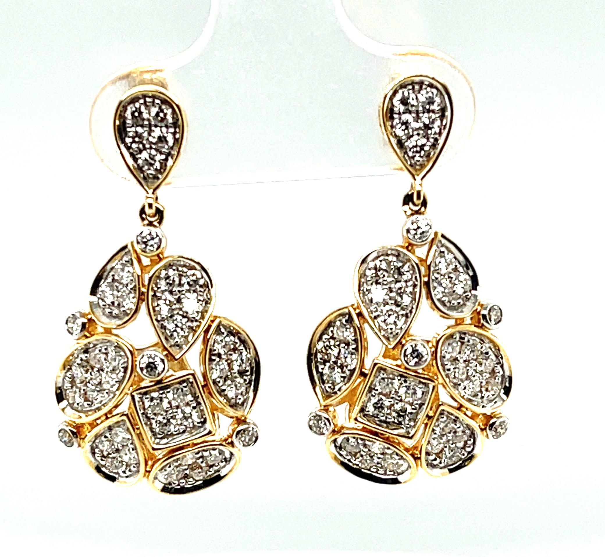 These lovely 14k yellow gold drop earrings feature over a carat of round, brilliant cut white diamonds pave set in an assortment of fun shapes and artfully arranged in a unique mosaic pattern!  This playful, yet elegant design is very versatile as