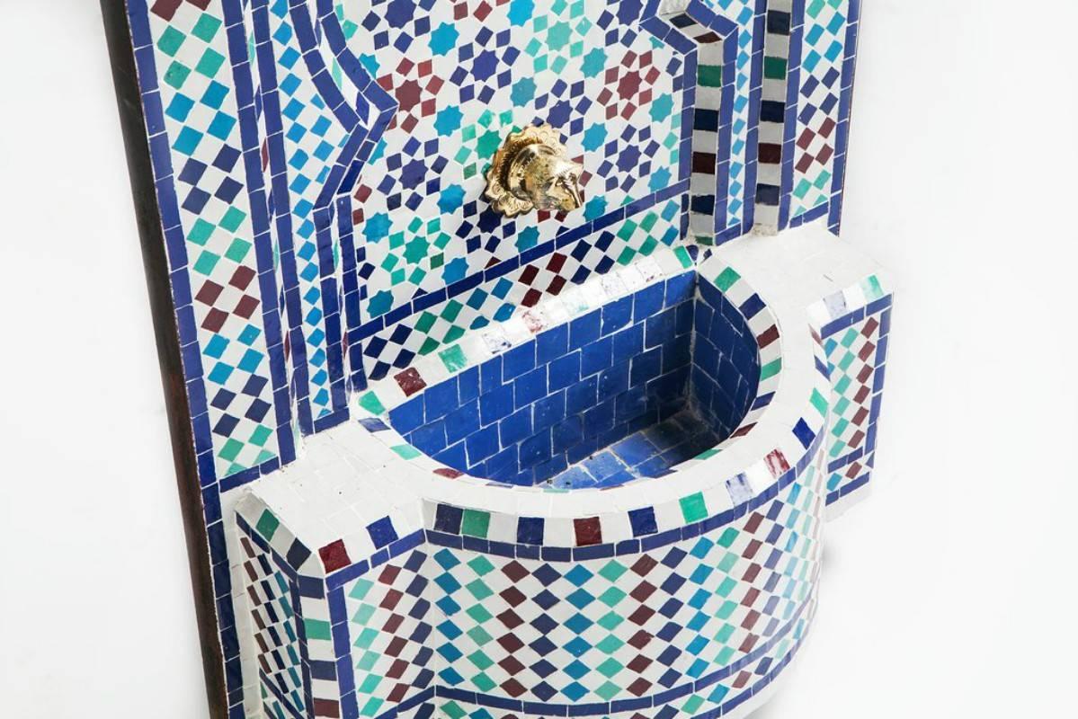 Mosaic Mediterranean water fountain. This stylish and soothing Mediterranean fountain features multicolored mosaic tiles and a uniquely hand-carved brass spout. For your added convenience, it comes ready to use with a pre-wired water pump.