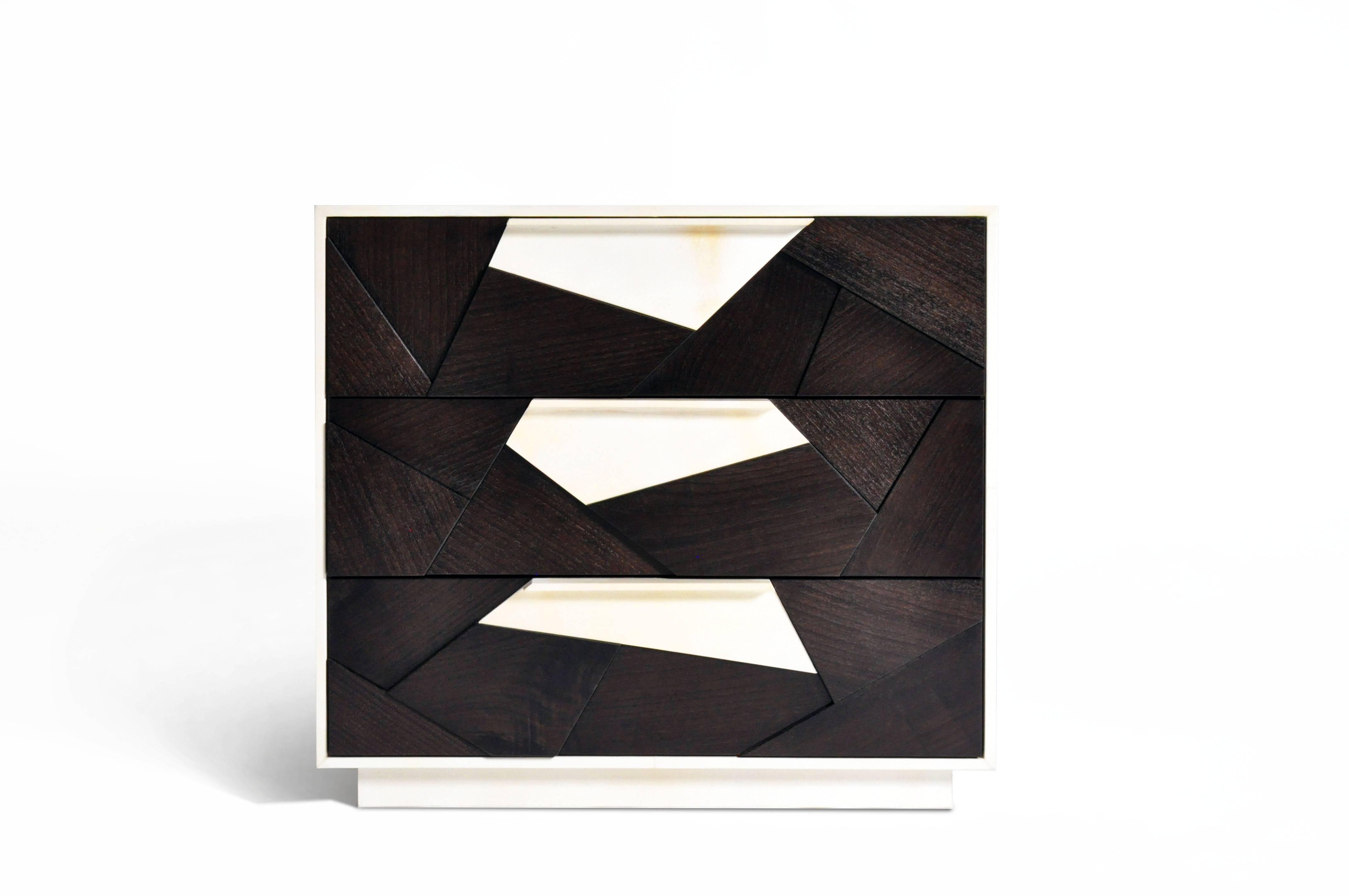 The Cubist nightstand in ebonized American walnut and parchment with a matt polish finish is a stunning artistic nod to modern and contemporary craft and design. The Cubist collection demonstrates the use of geometric shapes perfectly positioned at