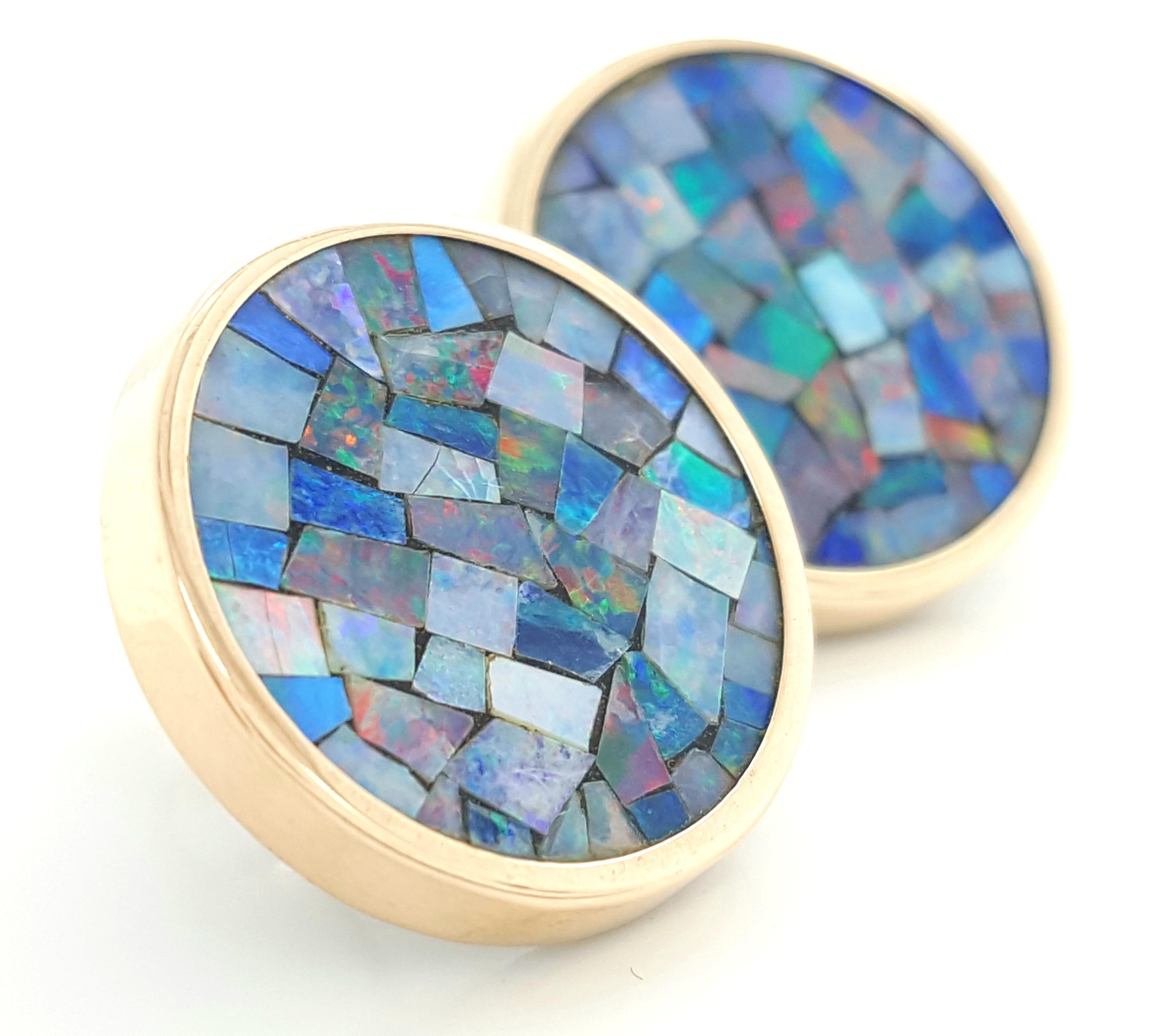 Classic Mosaic Opal earrings with High Polished 14 Karat Yellow Gold Bezels.  These earrings feature a memorizing display of  opals in a mosaic pattern set in a high polished bezel.  16.52 mm in diameter.  Completed by posts and frictions