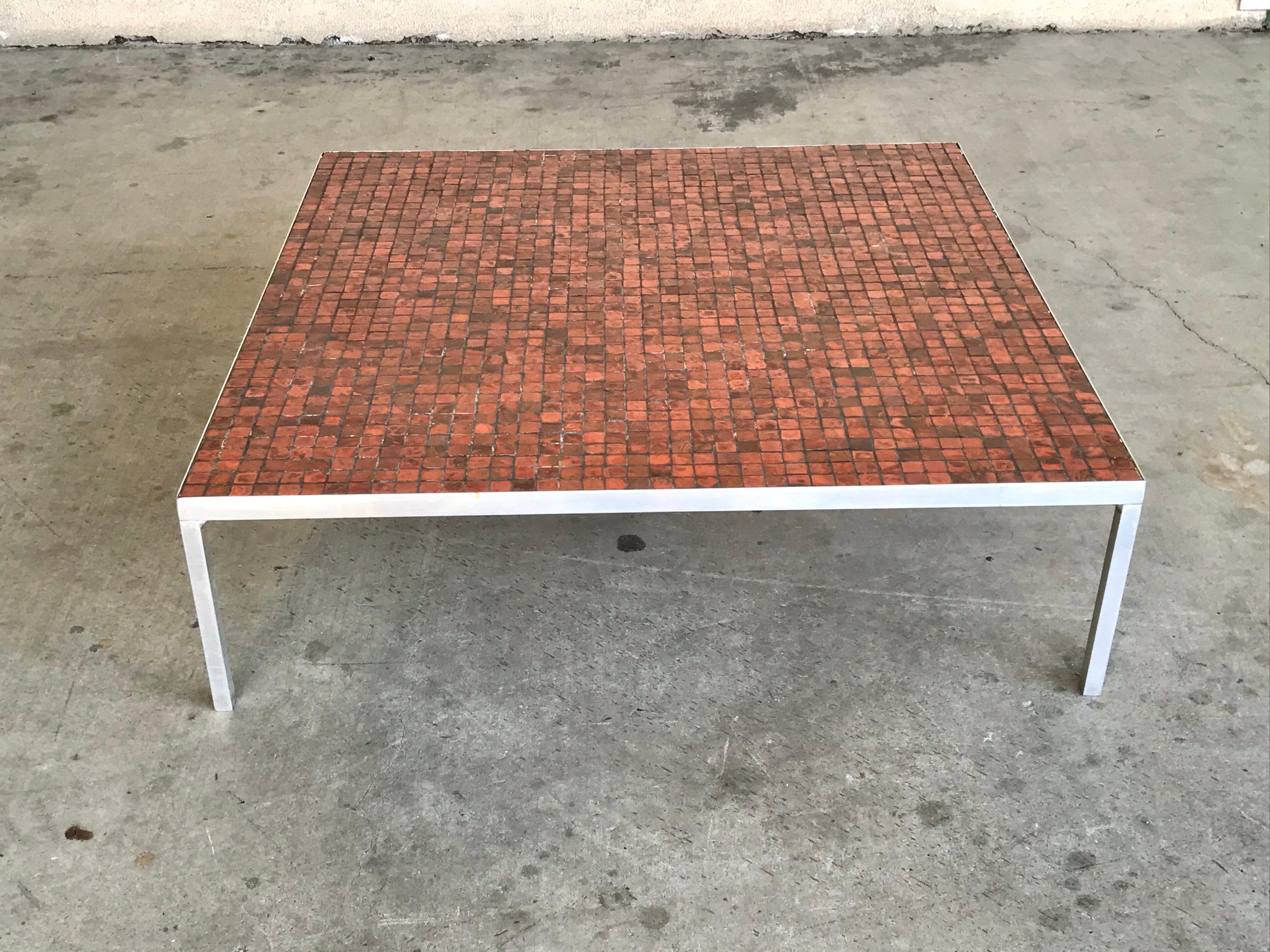 modernist design 
appears to be custom 
handcrafted glazed ceramic with beautiful red hues and aluminum frame base with original screws
nice low zen profile that can be used for any situation or environment in a leaving room or outdoors