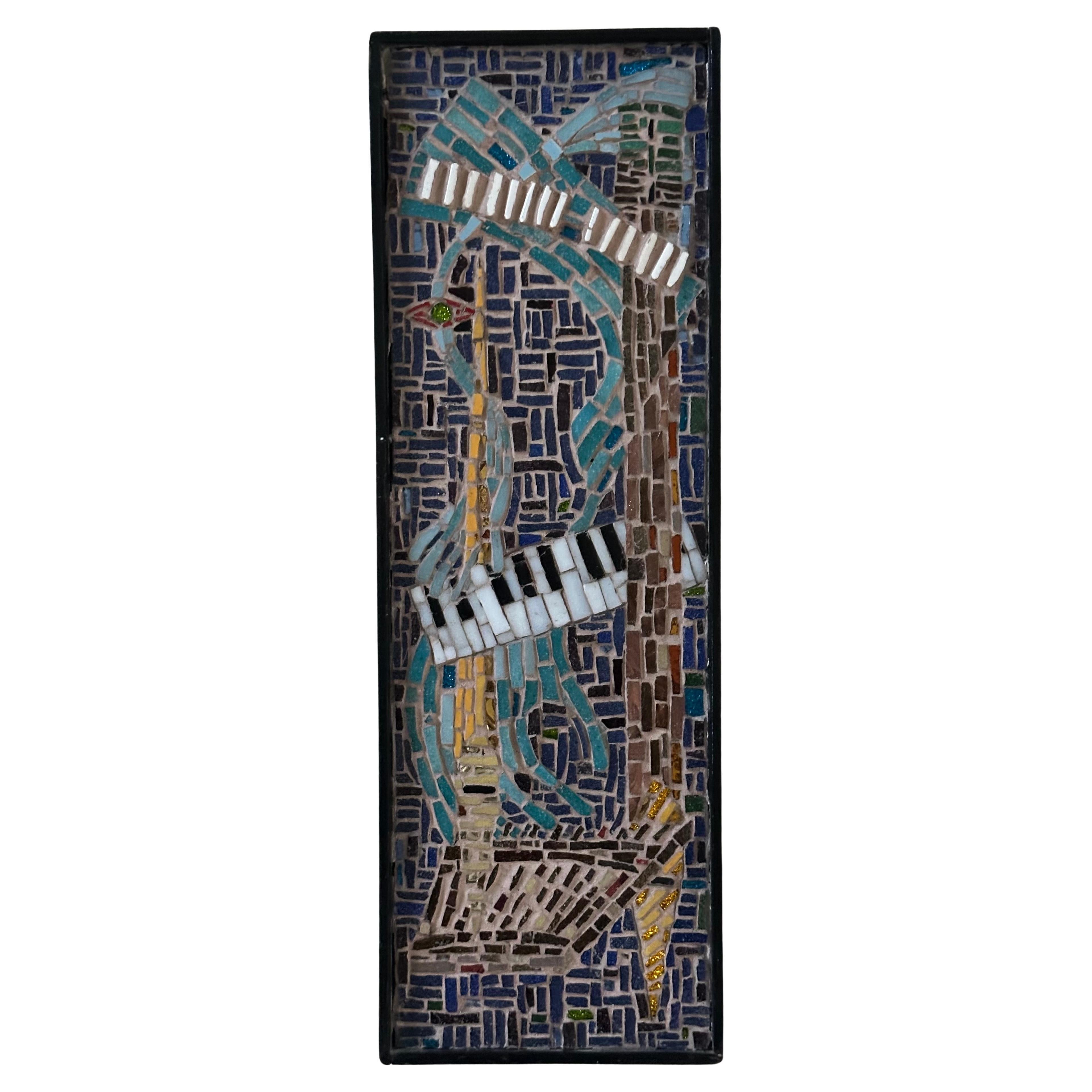 A gorgeous mosaic wall hanging on board by Hilke thor Straten, circa 1970s. The bright and colorful piece is in very good vintage condition and measures 5.5