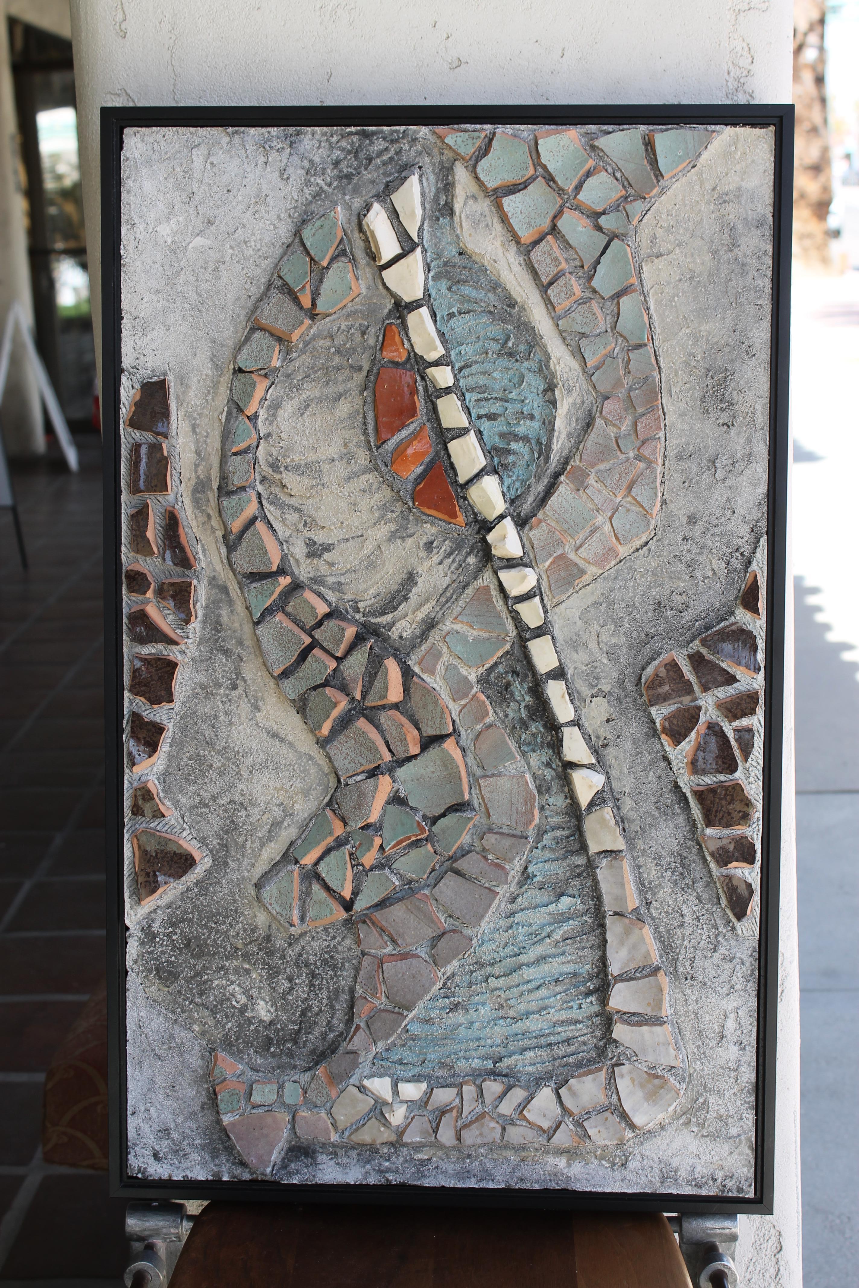 Mosaic by Beverly Lacy Taylor titled I-812. Mosaic consists of glazed stoneware and unglazed porcelain fragments. Beverly lived in Santa Fe, NM and exhibited in various shows. This mosaic was exhibited at the Forty-Sixth Fiesta show, Museum of New