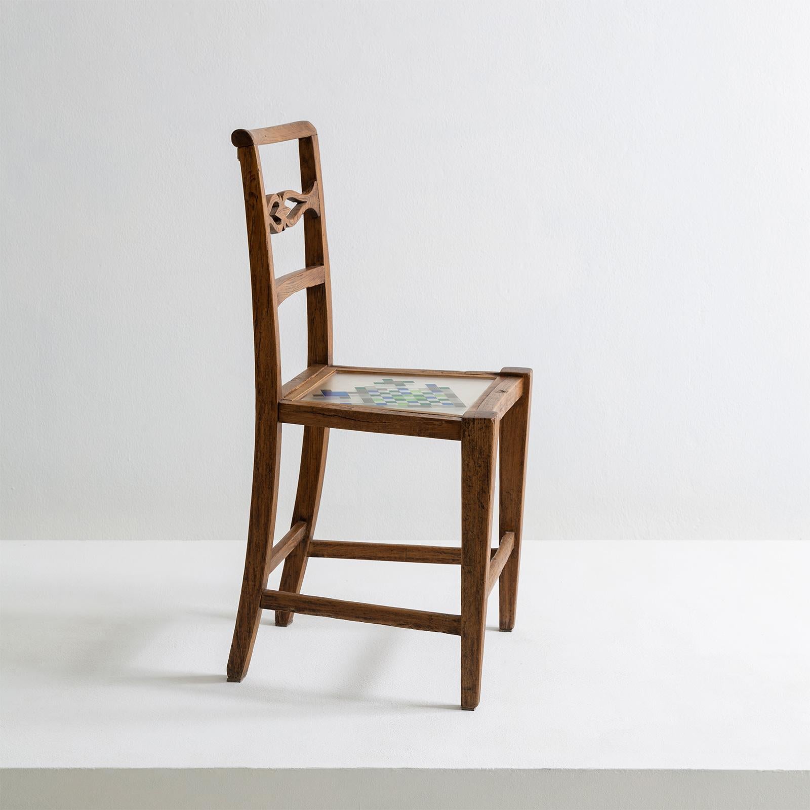 The Mosaiced chair is part of the mosaiced furniture collection that finds its inspiration in the element ‘water’. It’s made of restored chair from 1790, which belong to the style of Louis XVI. The chair is lightened through the sitting made of a