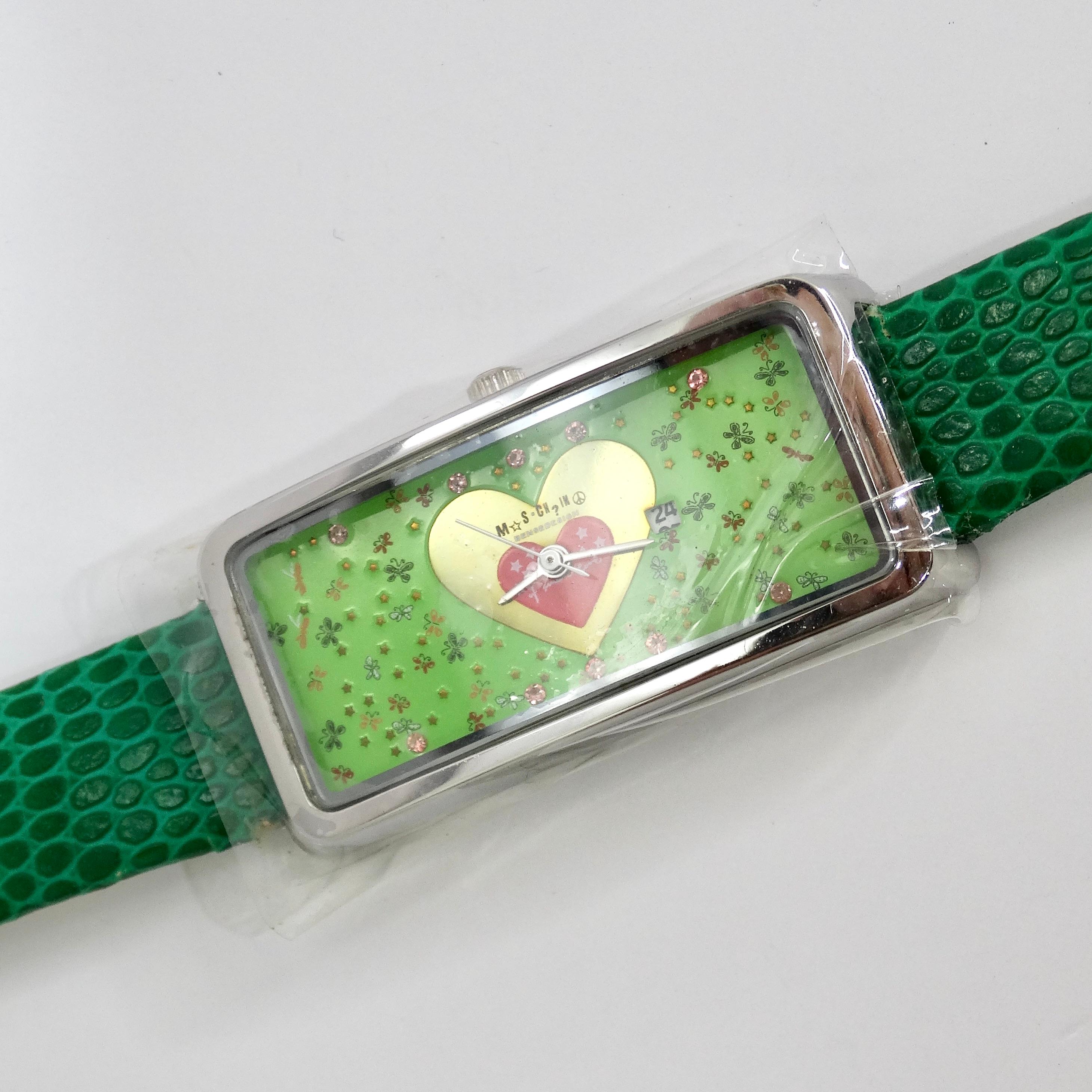 Introducing the delightful Moschino 1980s Green Lizard Embossed Watch, a charming vintage timepiece that captures the essence of playful elegance and vibrant style. This adorable deadstock Moschino watch features a deep emerald green lizard-embossed