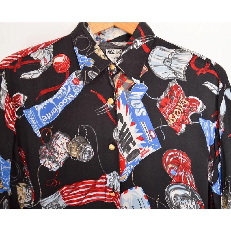 Vintage 1990's Moschino 'Coke & Toothpaste' patterned long sleeve cartoon shirt, in a silky black satin feel fabric. 

Features:
Central line button fasten
Long Sleeves
Loose Fit

100% Rayon

Sizing: 
Pit to Pit: 21''
Pit to Cuff: 20''
Nape to Hem: