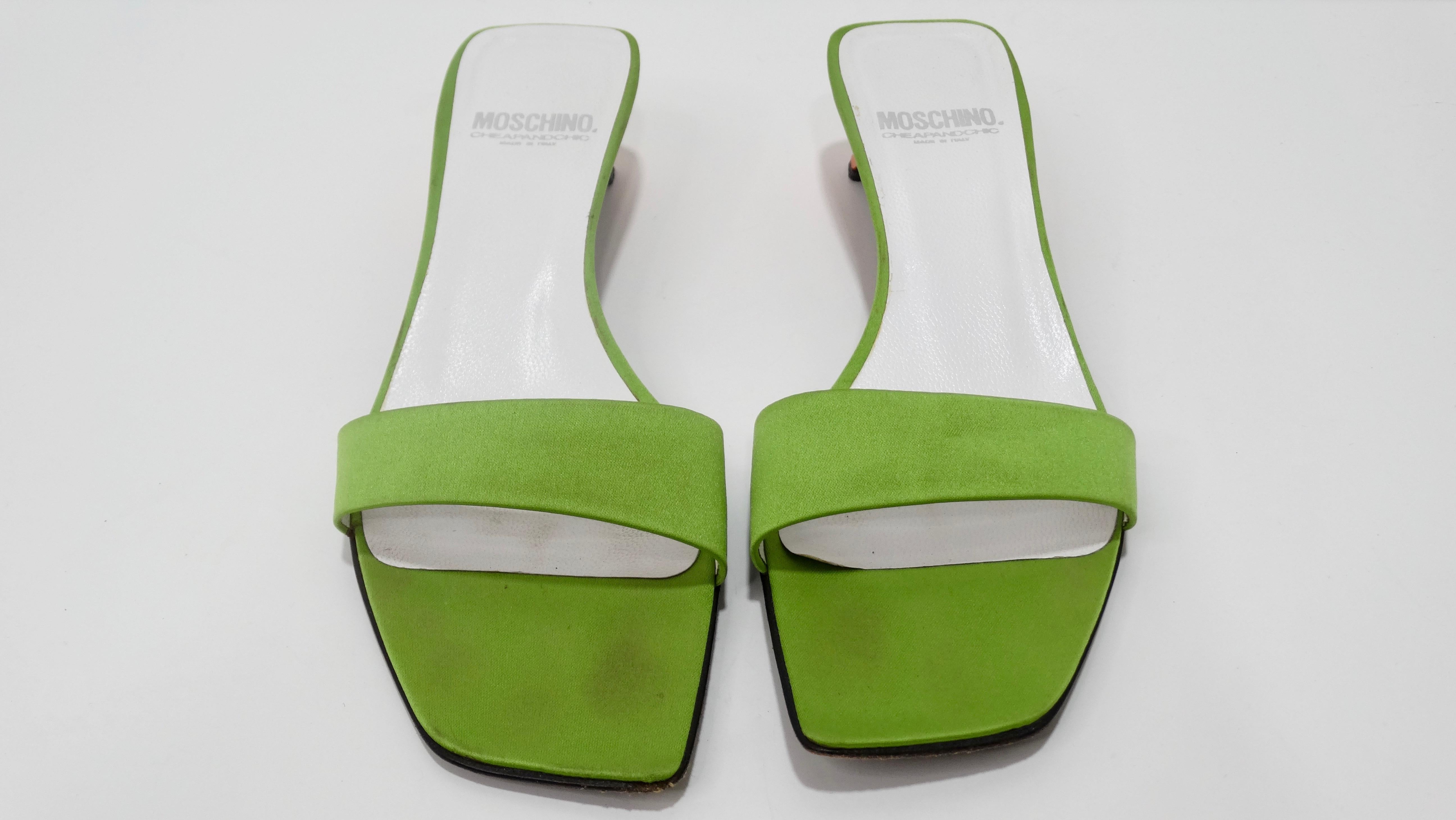 Add some color to your look with these adorable Moschino heels! Circa 1990s from Moschinos Cheap & Chic line, these shoes are a great lime green color and feature a tapered orange kitten heel. Made in Italy, marked a size 37. Pair these with your