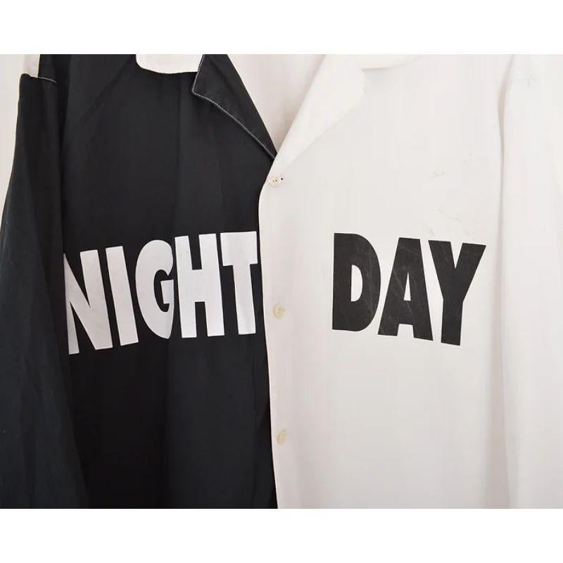 Early 1990's Moschino 'Night & Day' shirt in contrasting black & white cottons. 

MADE IN ITALY !

Features:
Central line button fasten
Long sleeves
Front pockets
'MOSCHINO' printed reverse

100% Cotton

Measurements given in inches: 
Pit to Pit: