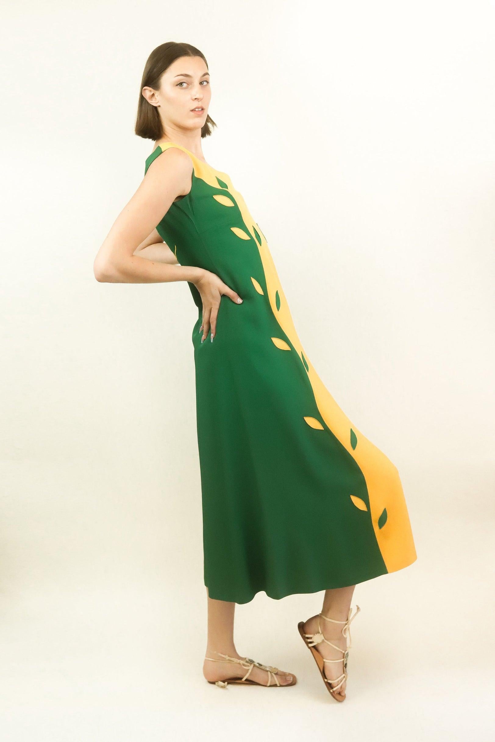Be the life of the party in this incredible 1994 Moschino dress. Perfect for wedding or birthday celebrations, this dress will have heads turning. Style for a garden party with a vibrant yellow clutch and chunky heels. 

The back embroidery