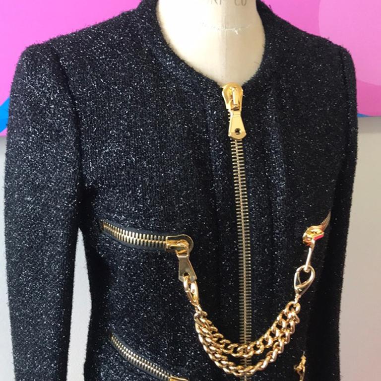 Moschino 30 years limited edition jacket chains

Unique 30 years Limited Edition jacket from Moschino w/ gold metal chains & sparkles/ metallic thread in the material - pair with black skinny pants and boots for Fall
Brand tends to run small. 
Size