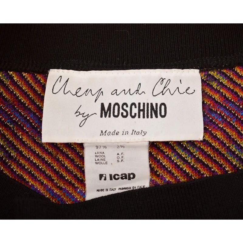 Fun Vintage early 1990's Moschino 'Cheap & Chic' colourful woven knitted pencil skirt. 

MADE IN ITALY !

Features:
High waisted fit
Stretchy knitted fabric
'Moschino Cheap & Chic' Spellout on both front and back
Above the knee length hem

97% Wool