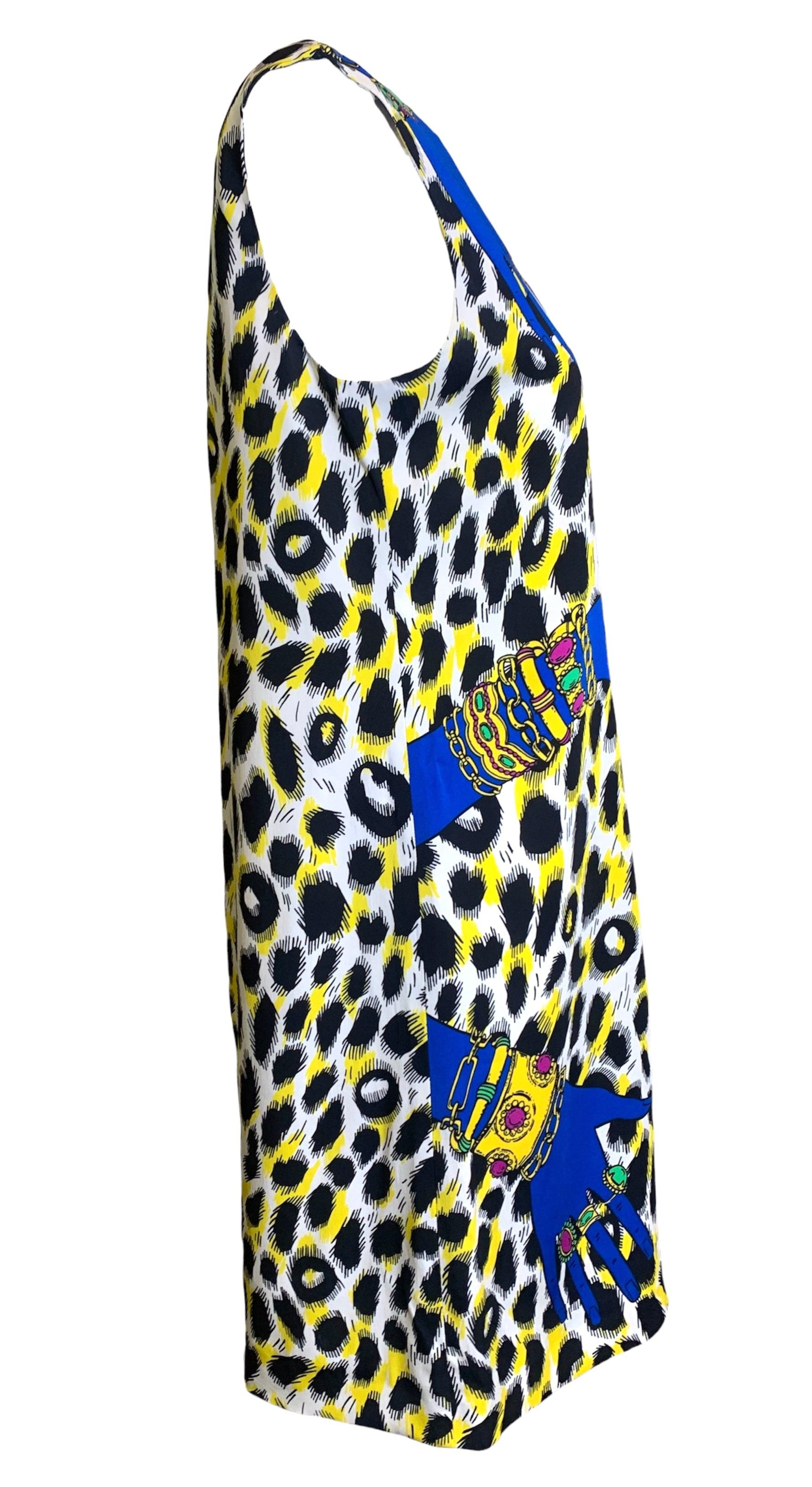 Time to get handsy! Eccentric blue hands cradle this neon-leopard shift to create a fun wearable piece of art. A light rayon makes this a soft and breezy spring/summer dress. Maximalism accentuates this piece; colorful gloves, hats, heels, bright
