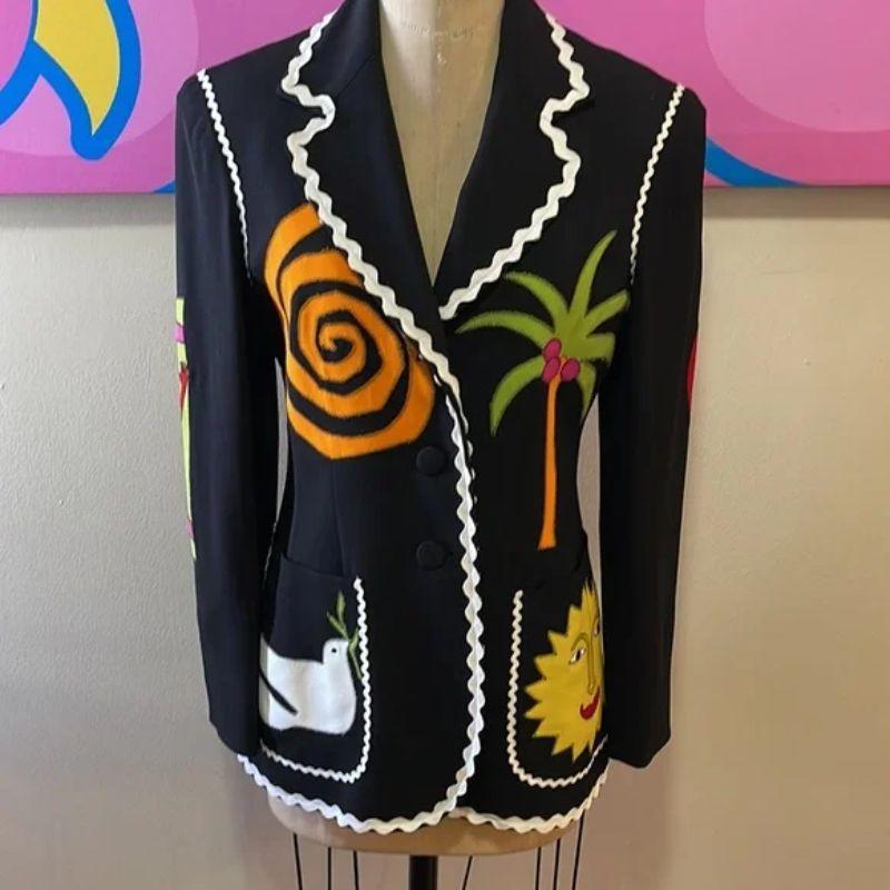 Moschino black crepe blazer sun the nanny iris apfel

This blazer was made famous when being featured on the TV show The Nanny in the 1990s and later on Iris Apfel. Collectible and rare.

Size 10
Across chest - 18 1/2 in.
Across waist - 15 1/2