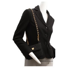 MOSCHINO by Franco Moschino, Blazer noir avec bourse et ornementation matérielle
