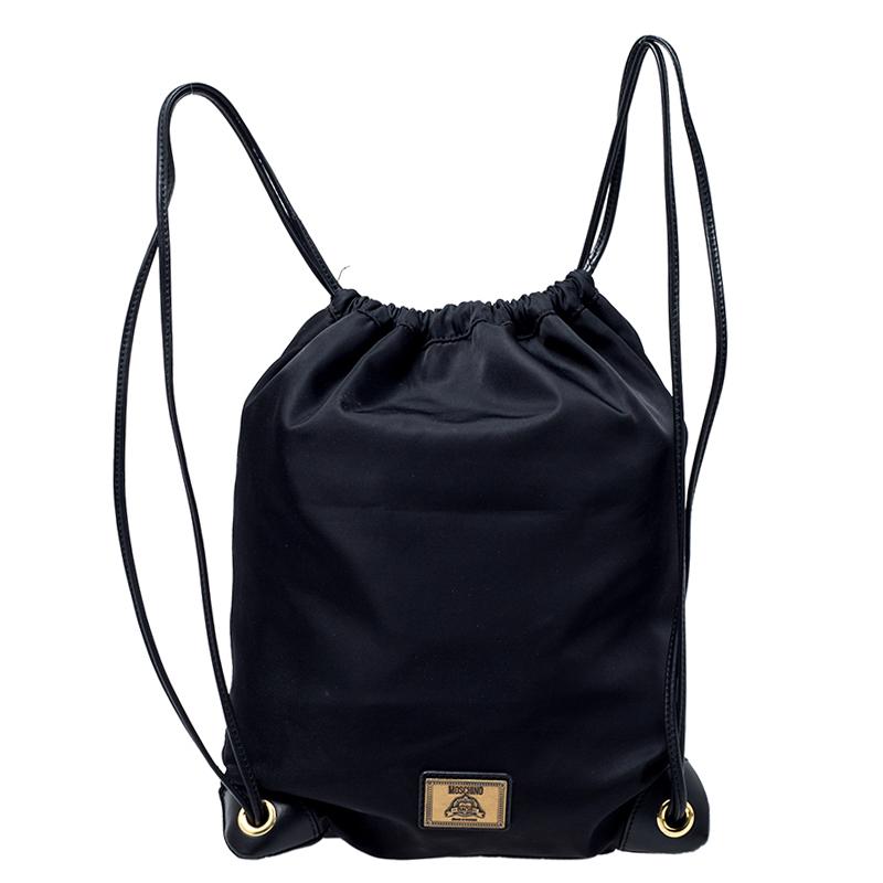 This rendition of a classic backpack from Moschino is stunning. It has been crafted out of durable nylon and features a drawstring closure, gold-tone zips on the side for convenience and the brand's logo in gold. It is the perfect bag for everyday