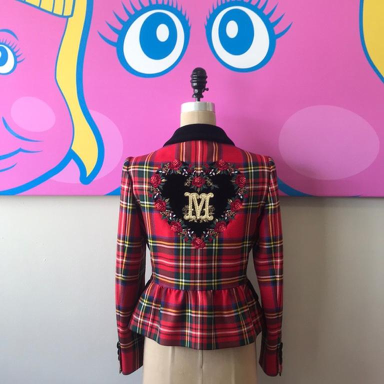 Moschino black heart plaid embroidered blazer

This unique red plaid blazer with black velvet buttons and trim with large embroidered M inside a Heart on the back, is a show-stopping piece. Perfect for Fall with black pencil pants and boots or a