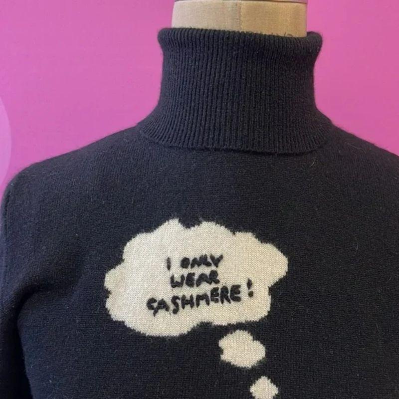Moschino black I only wear cashmere turtleneck sweater

Moschino Cheap and Chic makes Fall dressing shine with humor with this I Only Wear cashmere sweater. Pair with black skinny pants and boots for a finished look.

Size 6
Across chest - 16 1/2