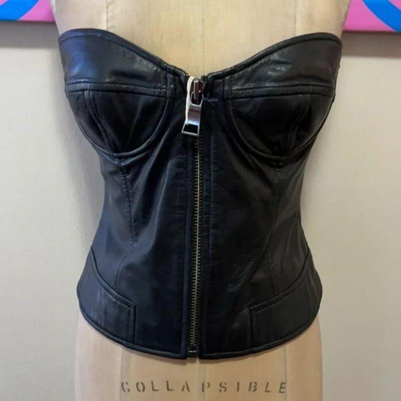 Moschino black leather bustier NWT

Being sexy is easy wearing this black leather bustier style top by Moschino! Pair with black skinny pants and boots and wear under a black leather biker jacket for a finished look.  Brand runs small, please check