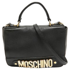 Moschino - Borsa in pelle nera con logo e patta - manico superiore