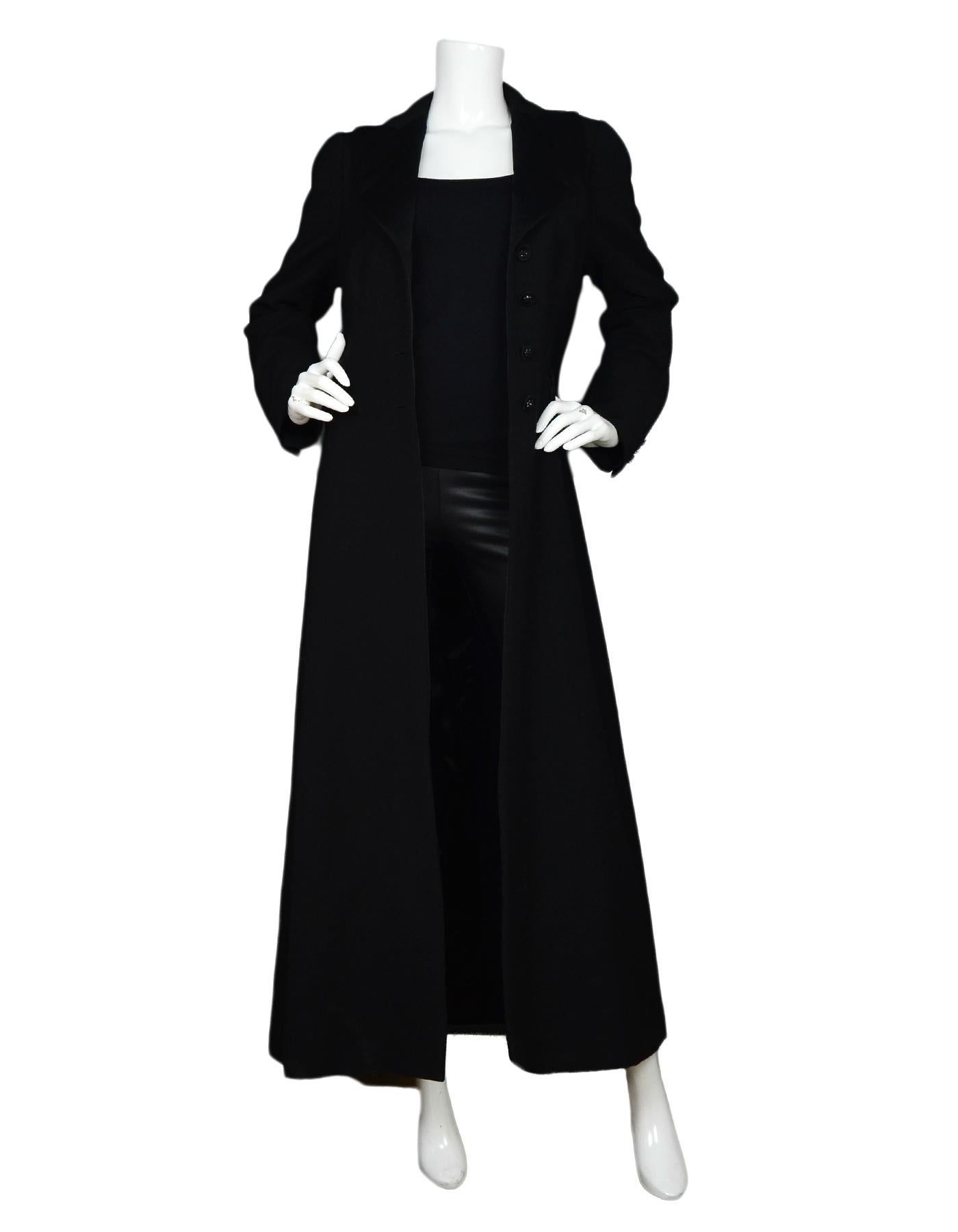 Moschino Black Long Floor Length Tux Style Coat Sz 10

Made In:  Italy
Color: Black
Materials: 10% wool
Lining: 100% rayon
Opening/Closure: Button front
Overall Condition: Excellent pre-owned condition 

Measurements: 
Shoulder To Shoulder: