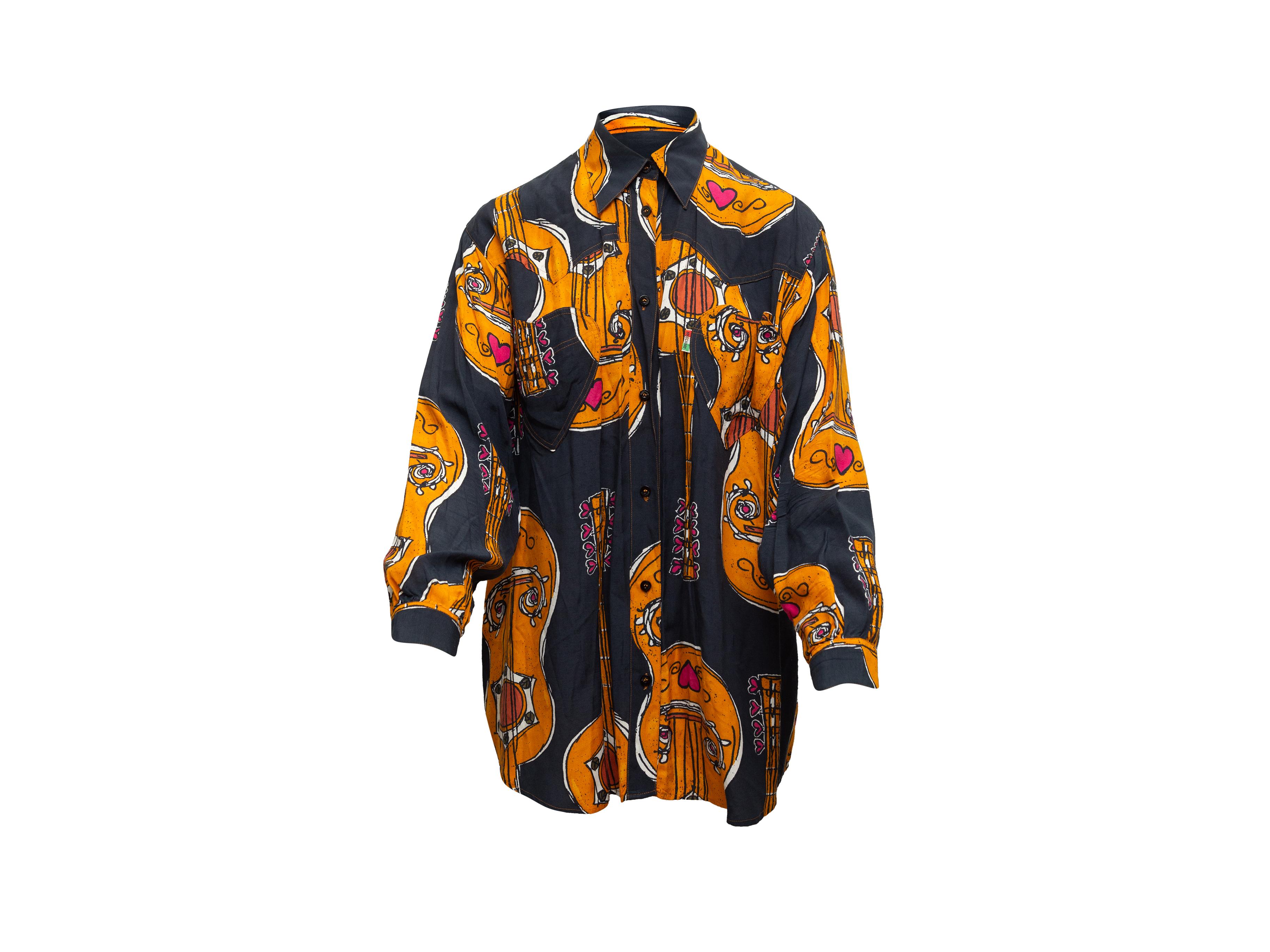 Product details: Vintage black and multicolor guitar print blouse by Moschino Jeans. Long sleeves. Pointed collar. Button closures at center front. 48