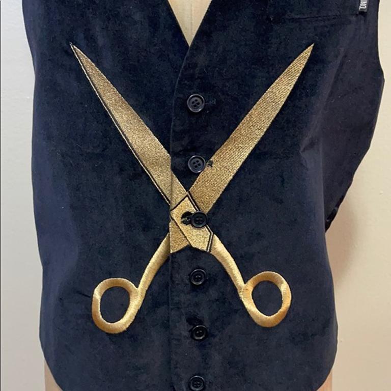 Moschino black navy velvet gold scissors vest

This vintage Moschino Cheap & Chic velvet vest is retro cool. Unique gold embroidered scissors design on the front shoes the humorous side of the designer, the late Franco Moschino. Pair with black