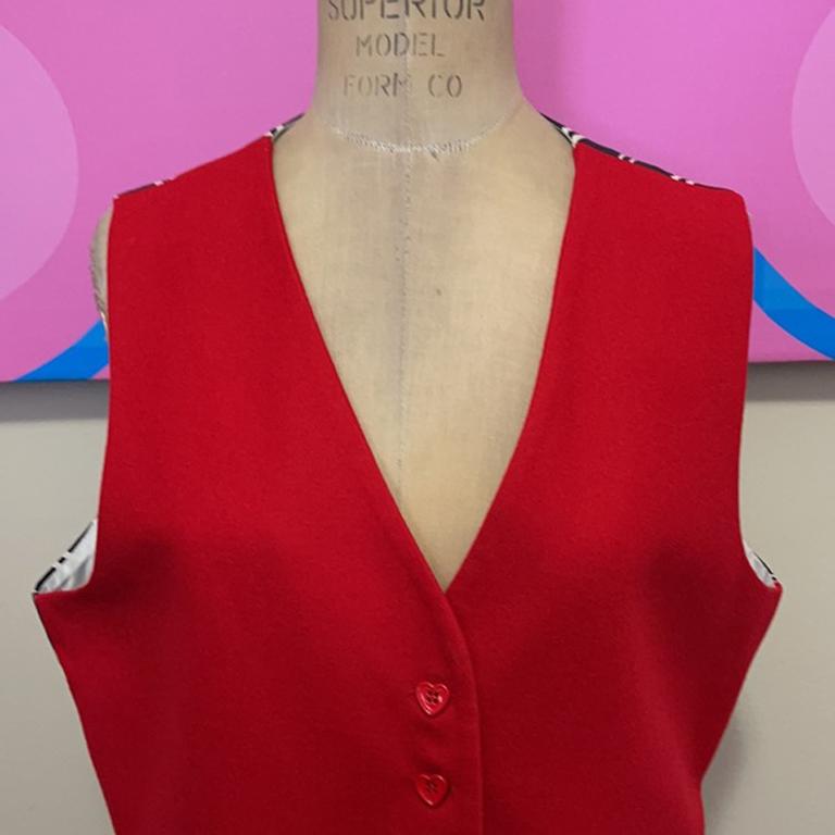 Moschino black red wool mickey mouse vest

Moschino Cheap and Chic is known for humor and fun and this Mickey Mouse ears vest is a great example of that. There are two versions, this is the WOMEN'S Version. Plastic Heart Buttons. 
Size 10

Across