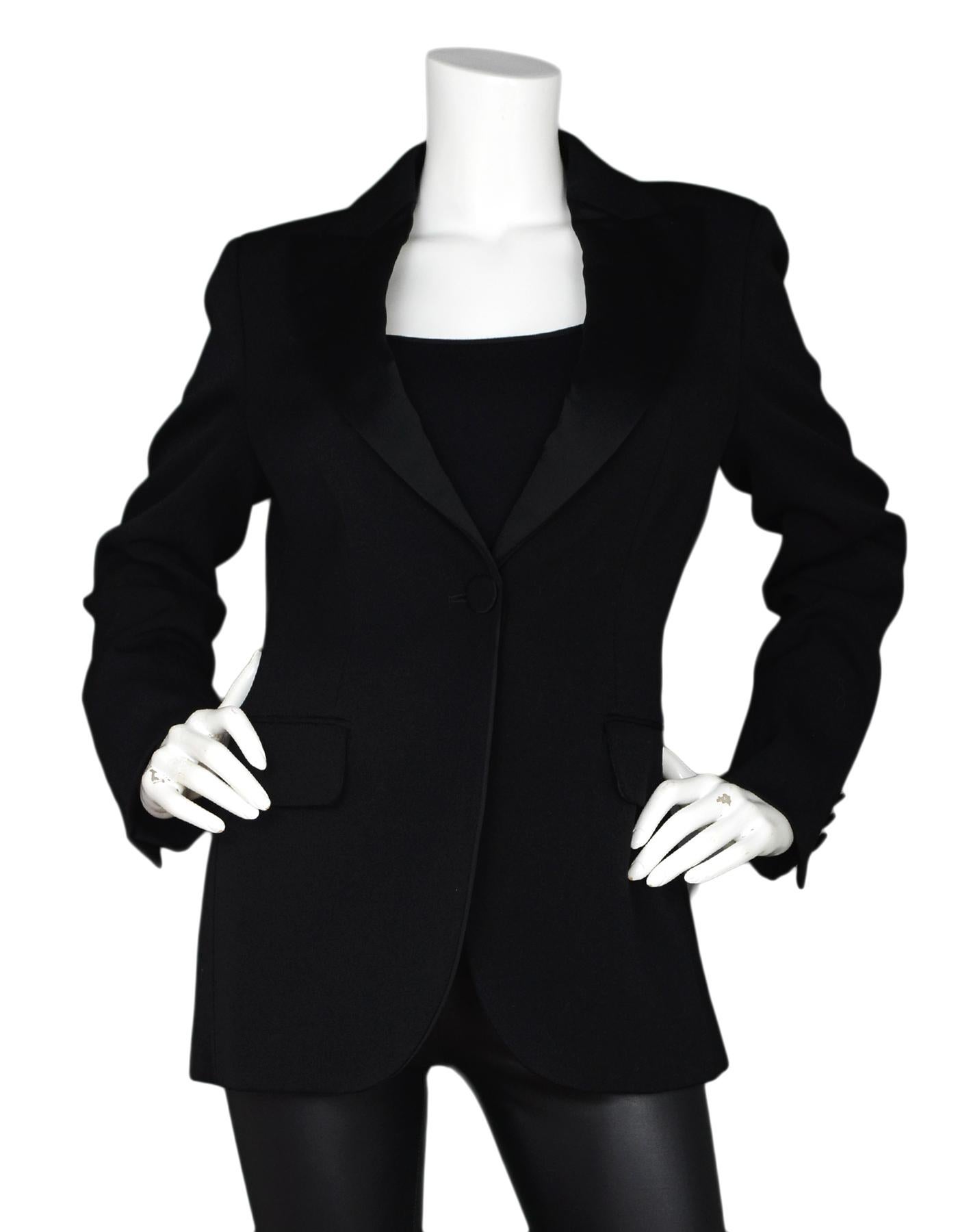 Moschino Black Tuxedo Blazer/Jacket W/ Satin Lapels Sz 10,
Jacket Only, Pictured With Item #122777-12 Moschino Crepe Satin Maxi Skirt Sz 8

Made In:  Italy
Color: Black
Materials: 100% wool
Lining: 60% rayon, 40% acetate 
Opening/Closure: Single