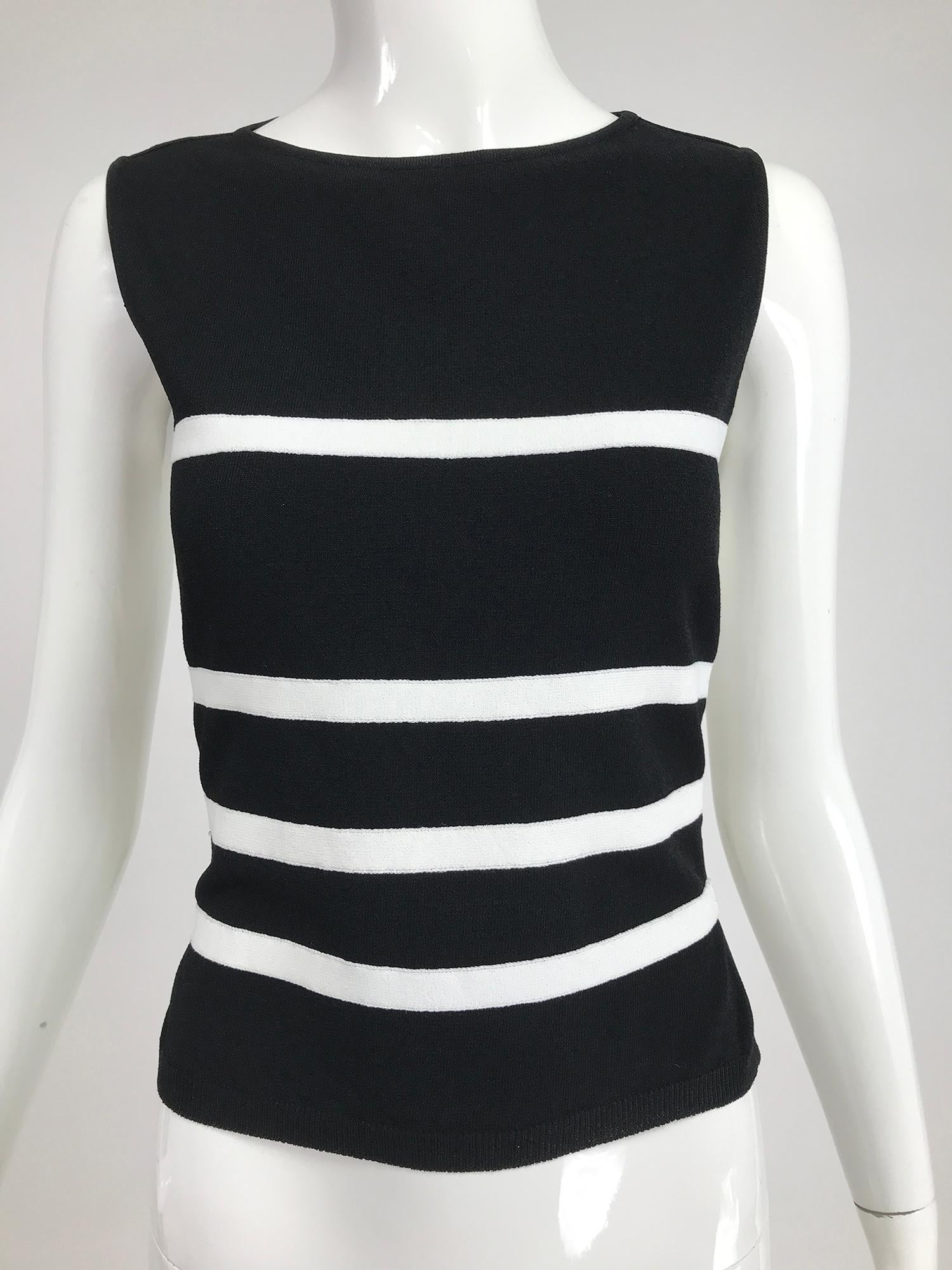 Moschino black & white stripe knit bare back top. Sleeveless top with a round neckline, the back covers the shoulder blades, below that there are 3 narrow white bands to the waist, your skin will be exposed between the white stripes. Great top in