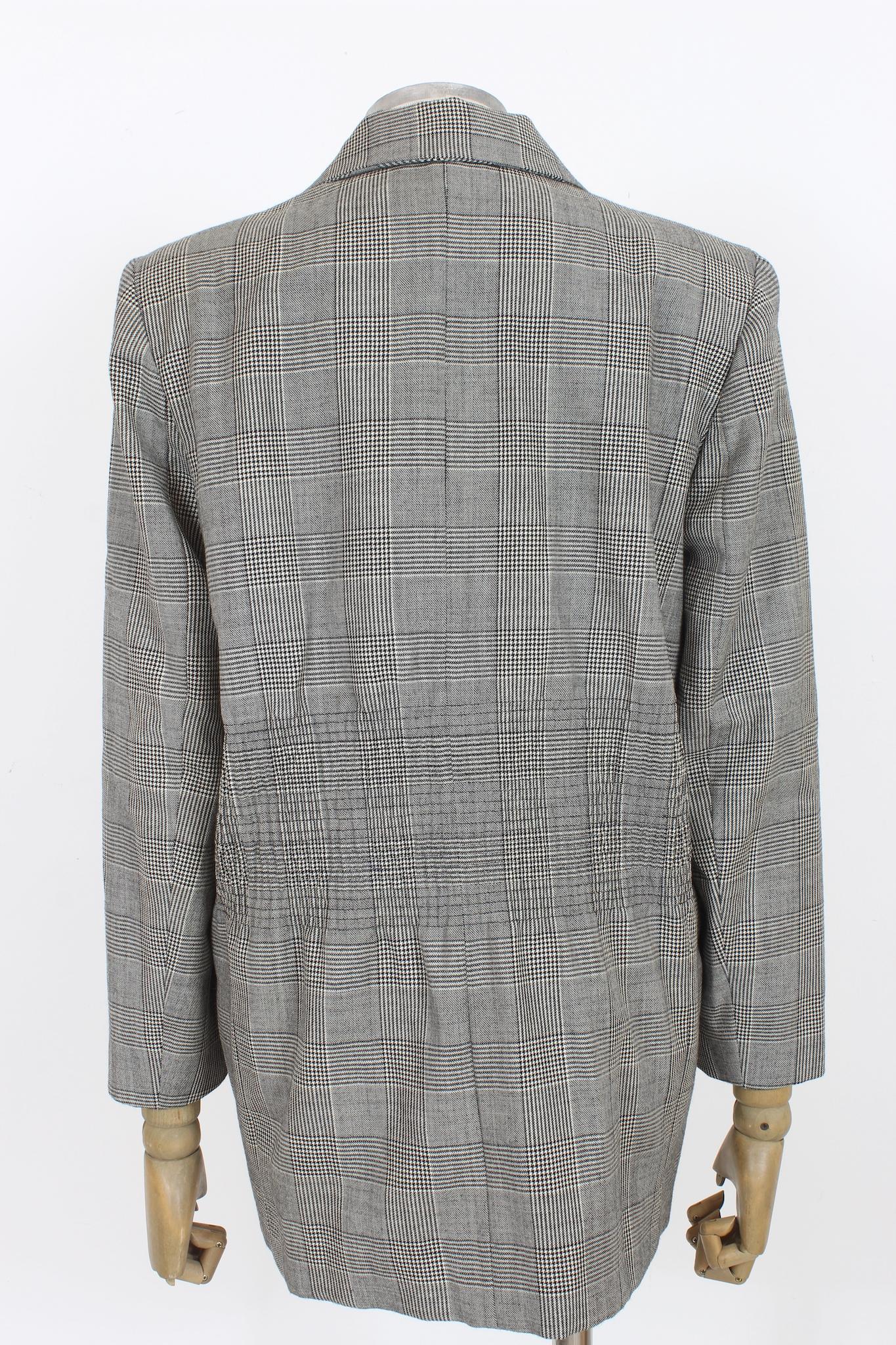 This classic Moschino black and white wool check jacket is an iconic vintage piece from 1980s. Featuring an elasticated waistband for perfect fit, this timeless piece will add a touch of elegance to any look.

Size: 42 It 8 Us 10 Uk

Shoulder: 44
