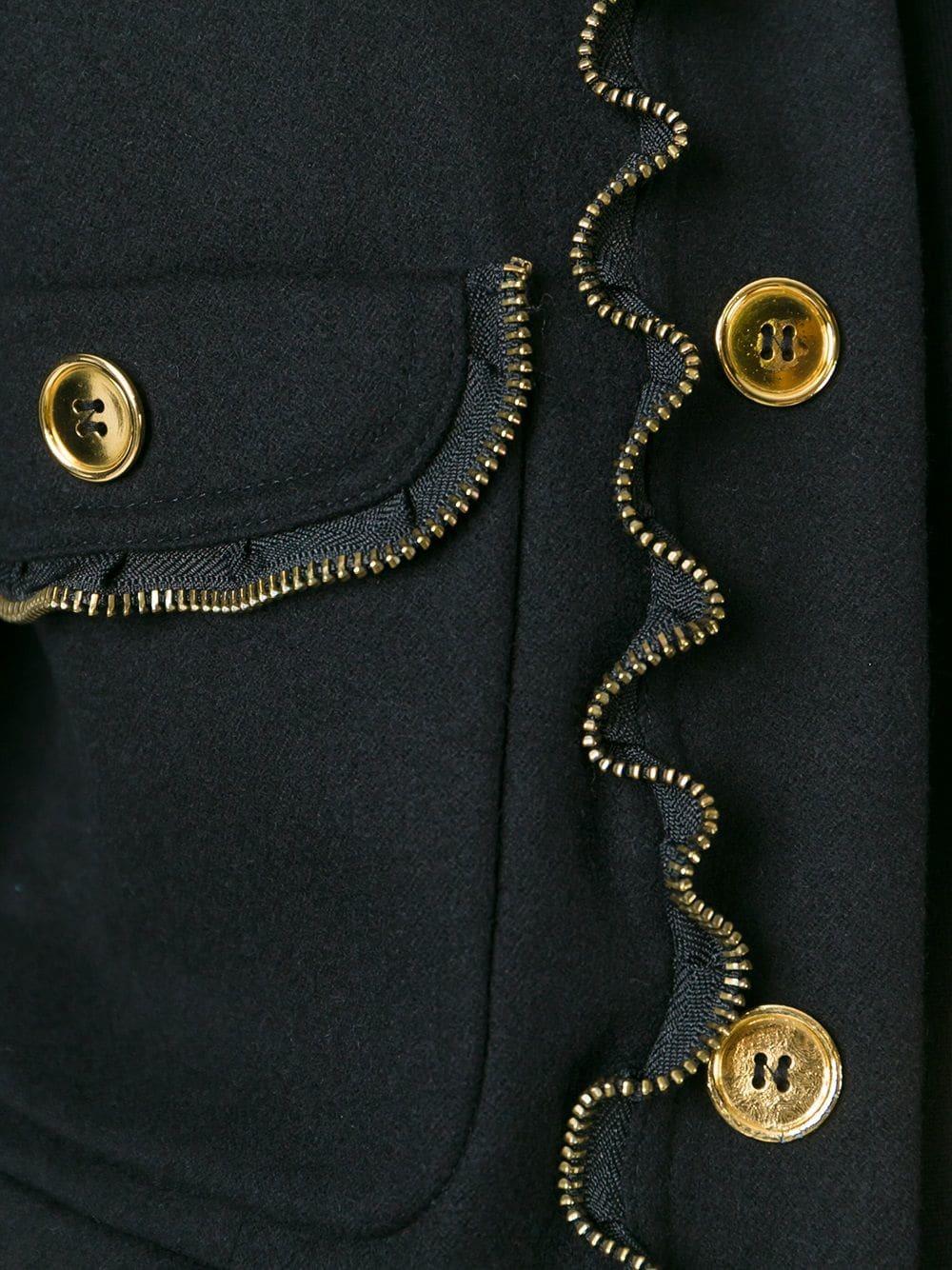 Cool Moschino wool and cashmere black jacket featured a gold-tone decorative buttons and a zip trim detail.

Size: 44 IT

Height: 52 cm
Bust: 49 cm
Shoulder: 42 cm
Sleeve: 60 cm