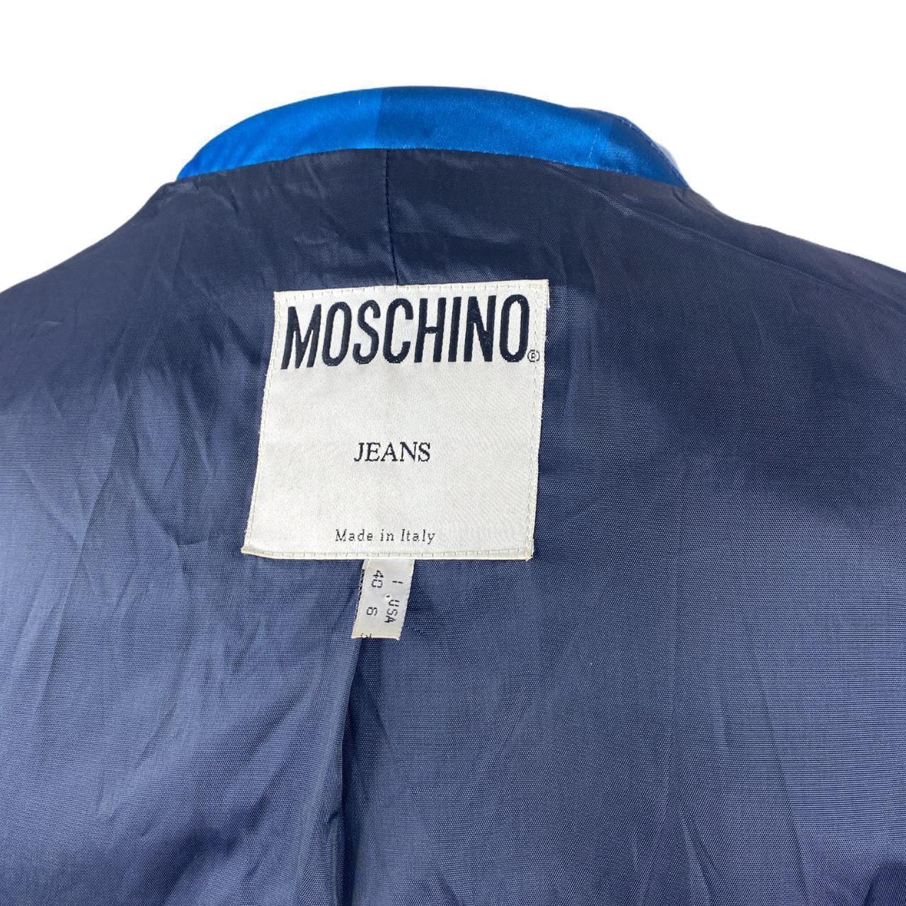 Moschino Blazer 

Blue Satin Square Jacket

CONDITION: This item is a vintage/pre-worn piece so some signs of natural wear and age are to be expected. However in good general condition

SIZE: 10

ACTUAL MEASUREMENTS:  Shoulder to Hem: 25