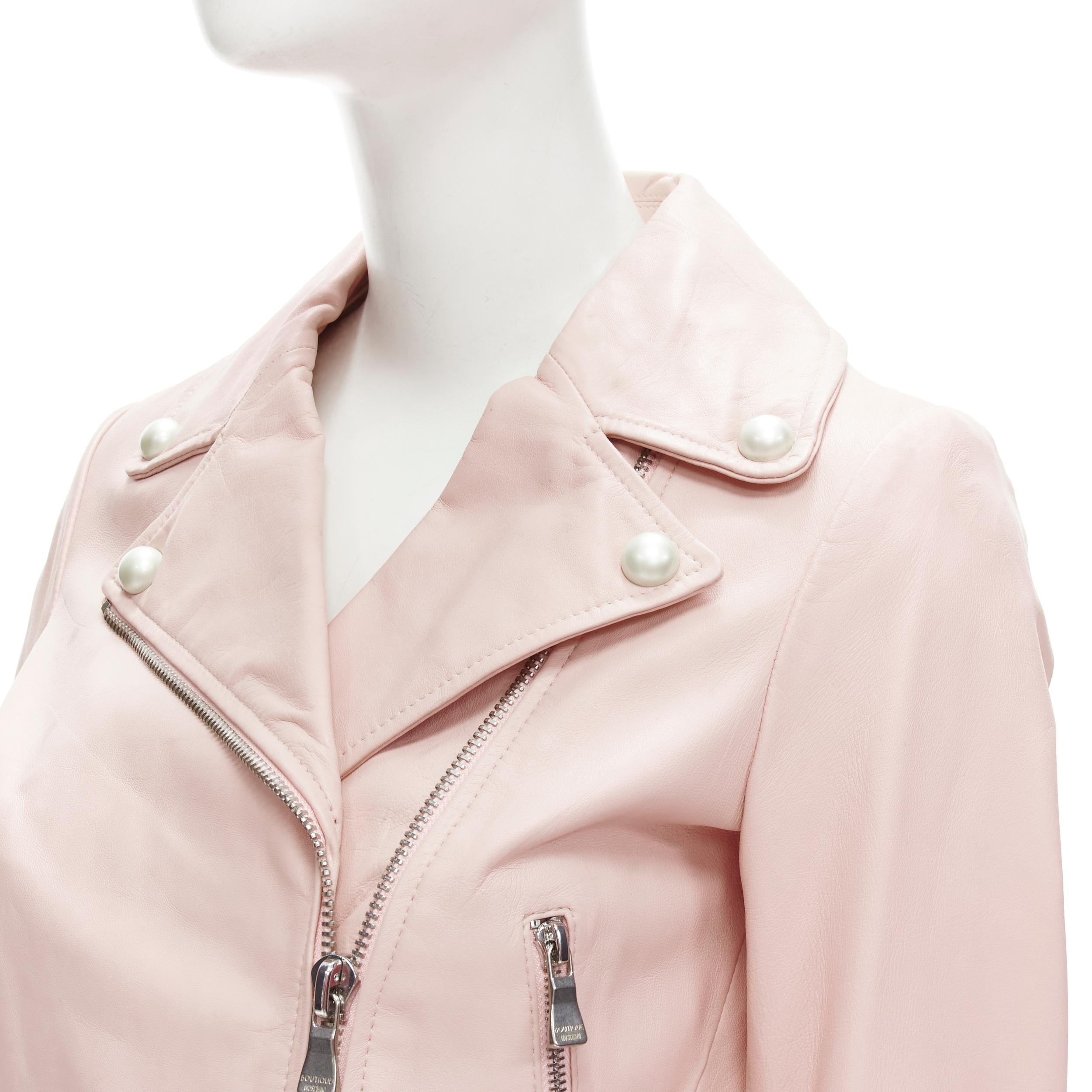 MOSCHINO Boutique light pink leather pearl button biker jacket S 
Reference: ANWU/A00473 
Brand: Moschino 
Material: Leather 
Color: Pink 
Pattern: Solid 
Closure: Zip 
Extra Detail: Faux pearl embellishment. Silver-tone hardware. Pink leather