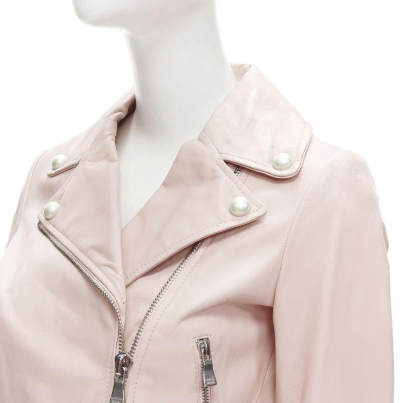 MOSCHINO Boutique light pink leather pearl button biker jacket S
Reference: ANWU/A00473
Brand: Moschino
Material: Leather
Color: Pink
Pattern: Solid
Closure: Zip
Lining:  Fully Lined
Extra Details: Faux pearl embellishment. Silver-tone hardware.