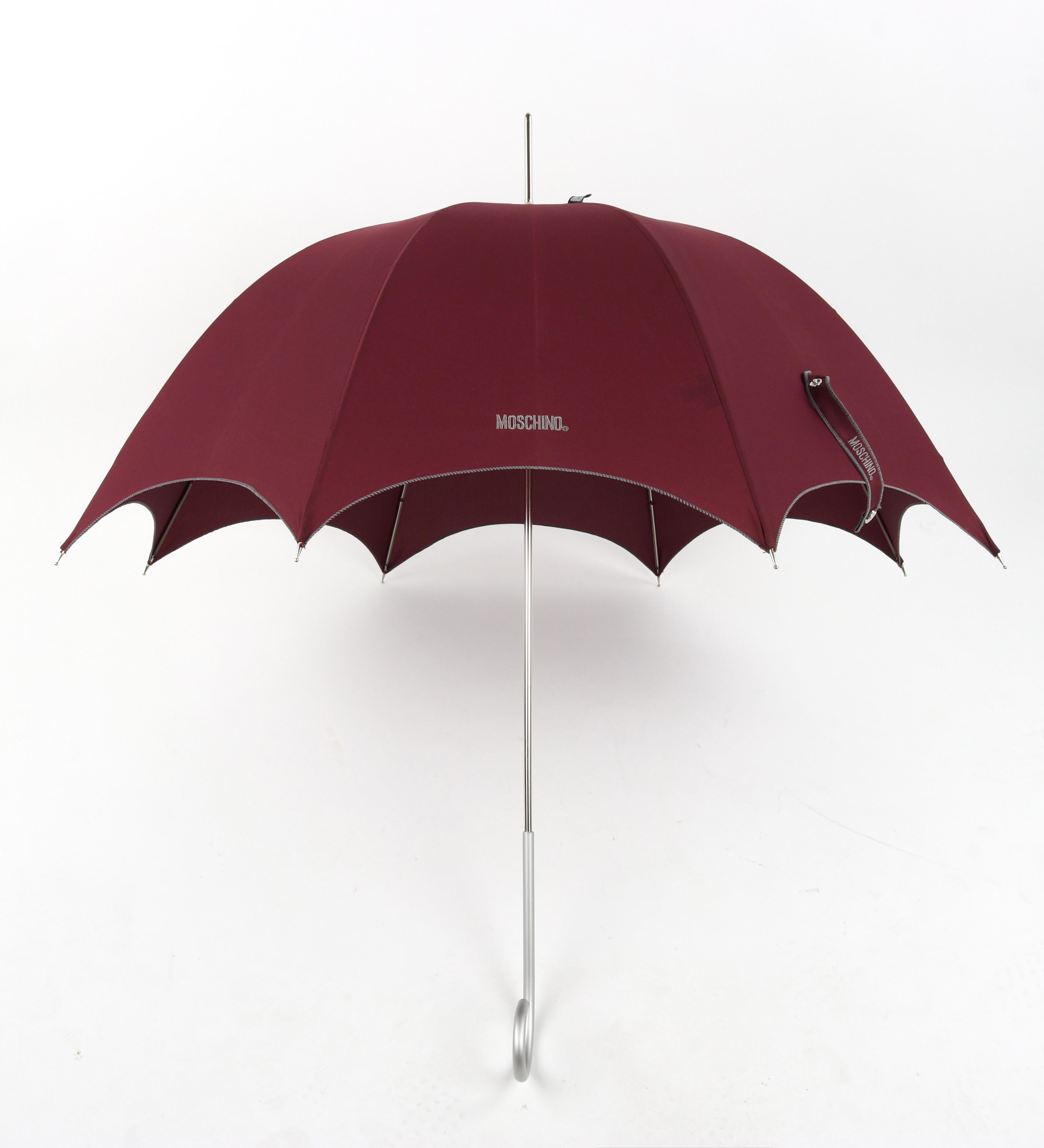 MOSCHINO by DROPS Custom Made Burgundy Hook Handle Bubble Dome Parasol Umbrella

Brand / Manufacturer: Moschino by Drops
Label(s): Original 