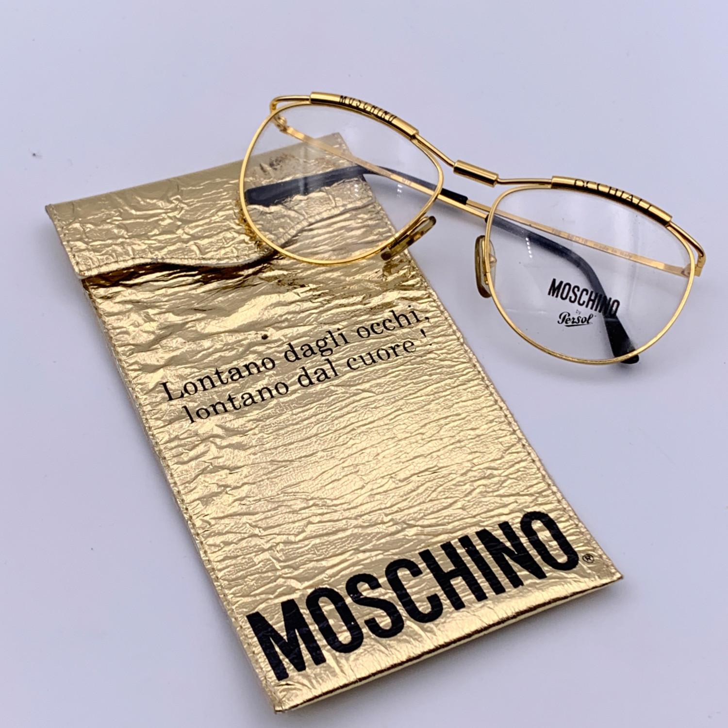Gold metal eyeglasses by Moschino by Persol. Oval design. Model: M18. 56/18 - 135 mm. 'Moschino' and 'Occhiali' embossed on the upper part of the frame.Clear demo lens. Made in Italy

Details

MATERIAL: Metal

COLOR: Gold

MODEL: M18

GENDER: