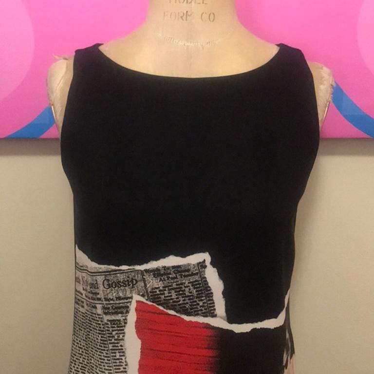 Moschino cheap chic black motorcycle dress

This super cute shift dress has a bold motorcycle design on the front! Perfect for Fall worn with tights and knee hight boots! Lay a turtleneck sweater underneath. 

Size 4

Across chest - 17 inches
Across